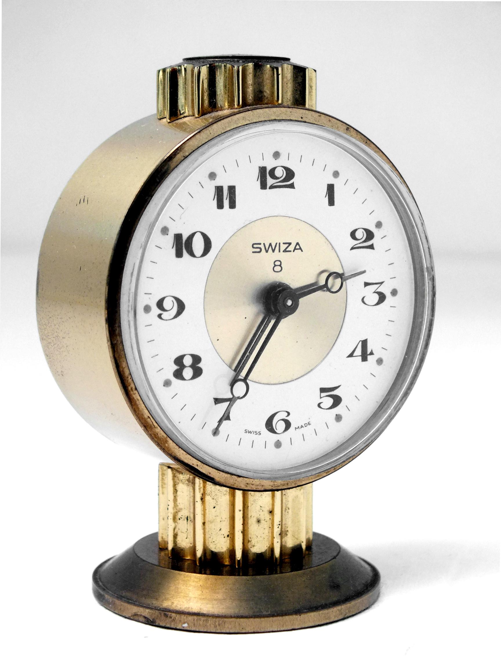 Swiza 8 days vintage alarm clock Swiss design table clock in brass in good vintage condition.
