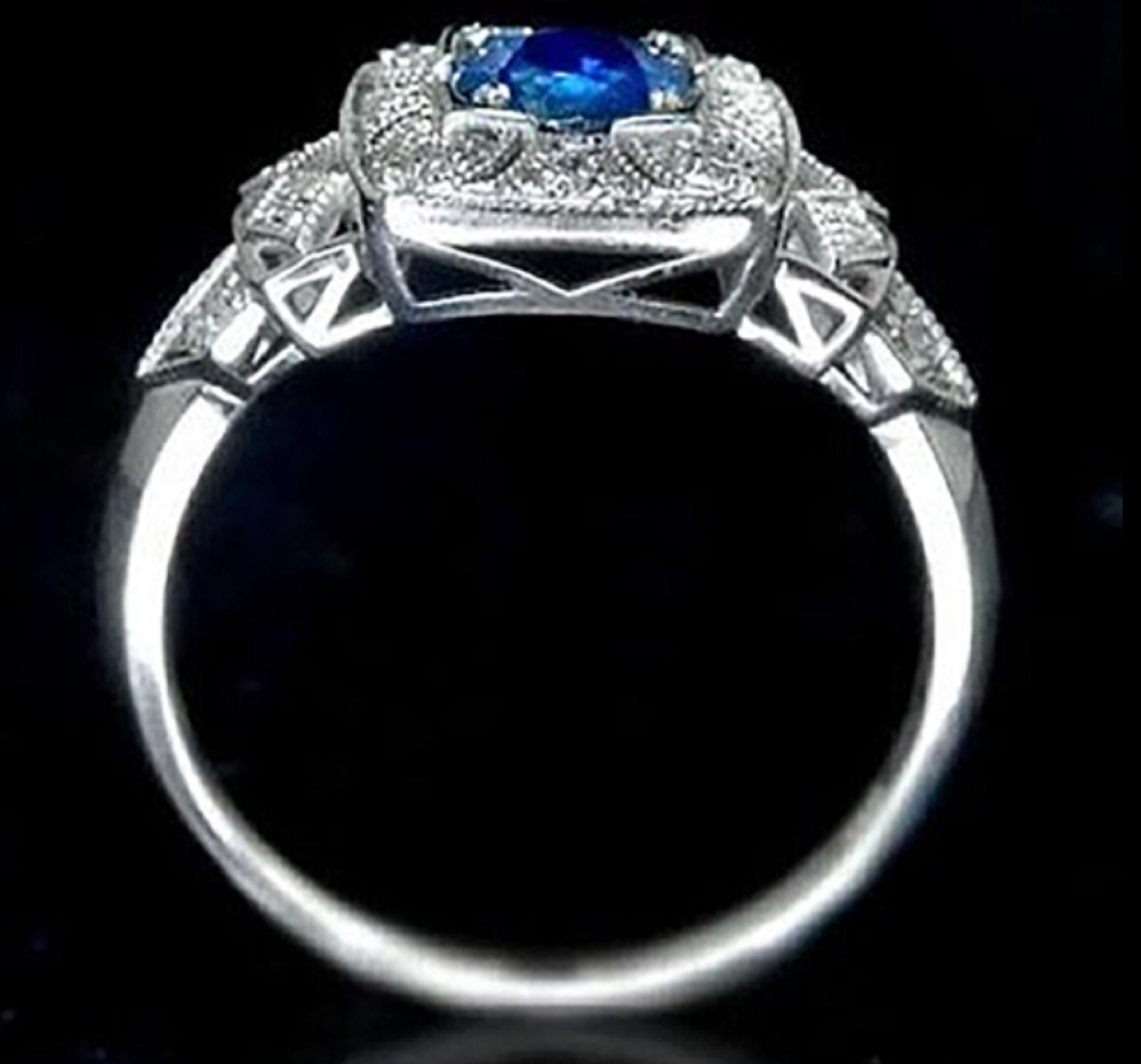 Gorgeous center sapphire. The color of the sapphire has a vibrant, vivid blue color that must be seen in person to be fully appreciated. The sapphire is well cut and exhibits lovely sparkle. 

The center is surrounded by 16 brilliant diamonds, set