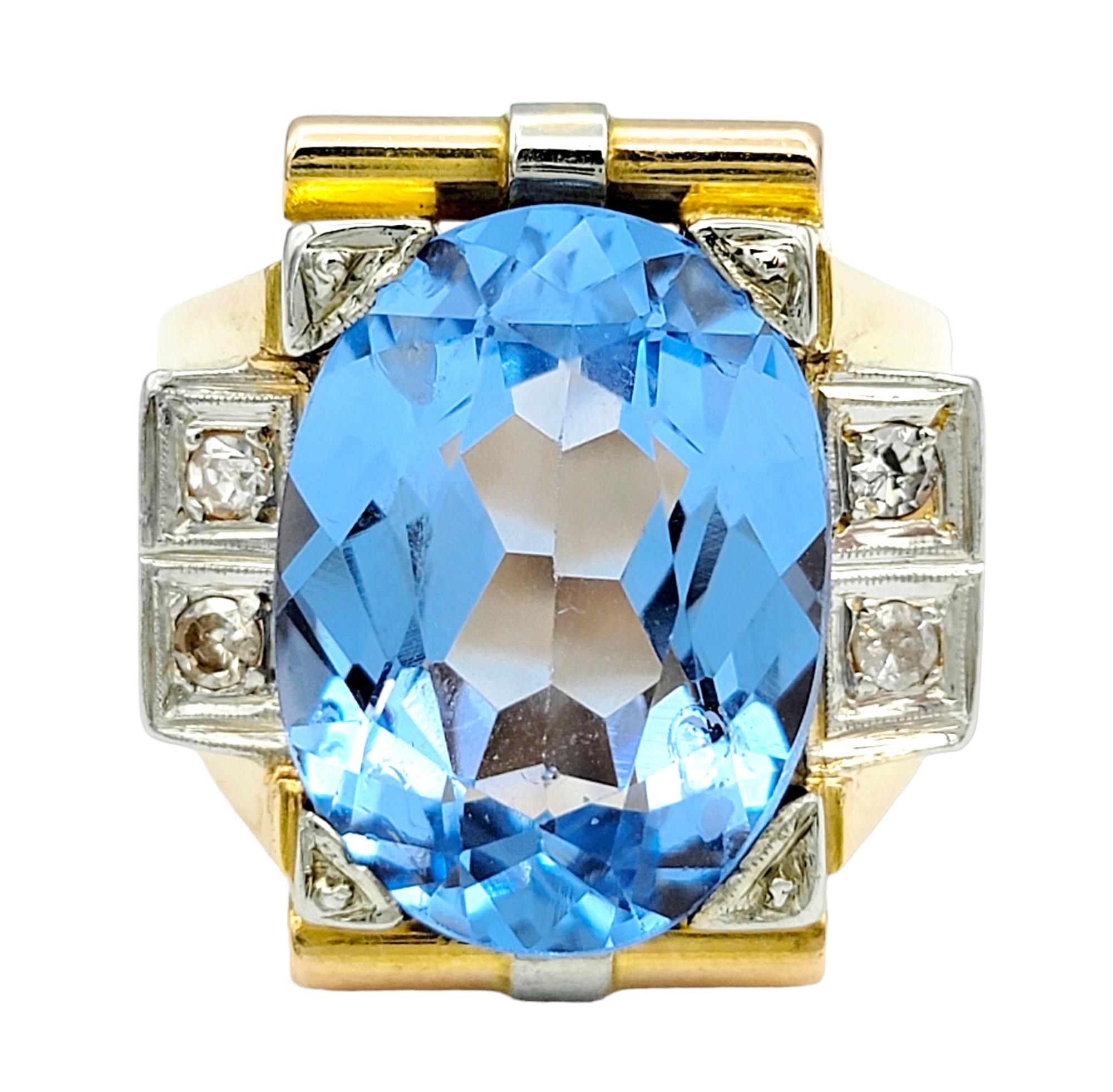 Ring Size: 10

This striking ring boasts a captivating 13.2 carat synthetic oval-cut spinel as its centerpiece, exuding a brilliant blue hue. Framed by four round single cut diamonds and set in an elongated rectangular arrangement, the piece is a