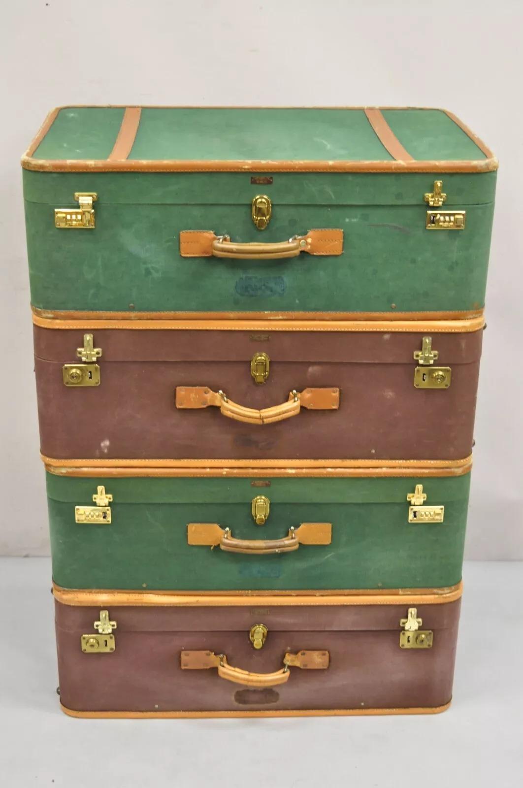 Vintage T. Anthony Art Deco Leather and Canvas Green & Brown Luggage - 4 Pc Set. Listing includes (2) green suitcases, (2) brown suitcases all with canvas hard case with brown leather trim. Circa Early 20th Century. Measurements: 12