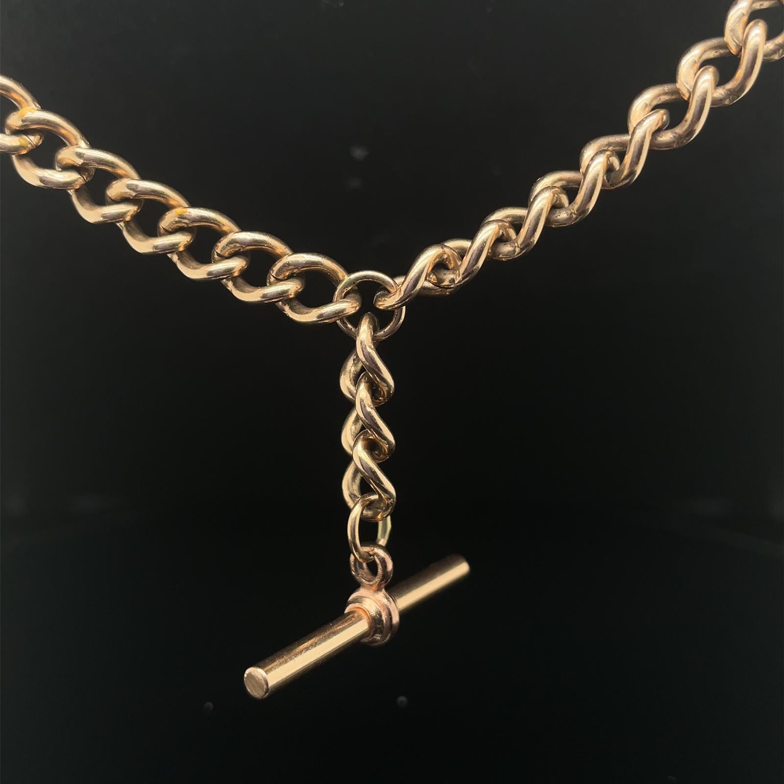 A vintage T Bar Chain in 9 karat yellow gold, circa 1990.

This T-bar chain features polished curb links throughout with a circular link to its centre from which the T-bar suspends.

Stamped '375' for 9 karat gold, with hallmarks for Sheffield,