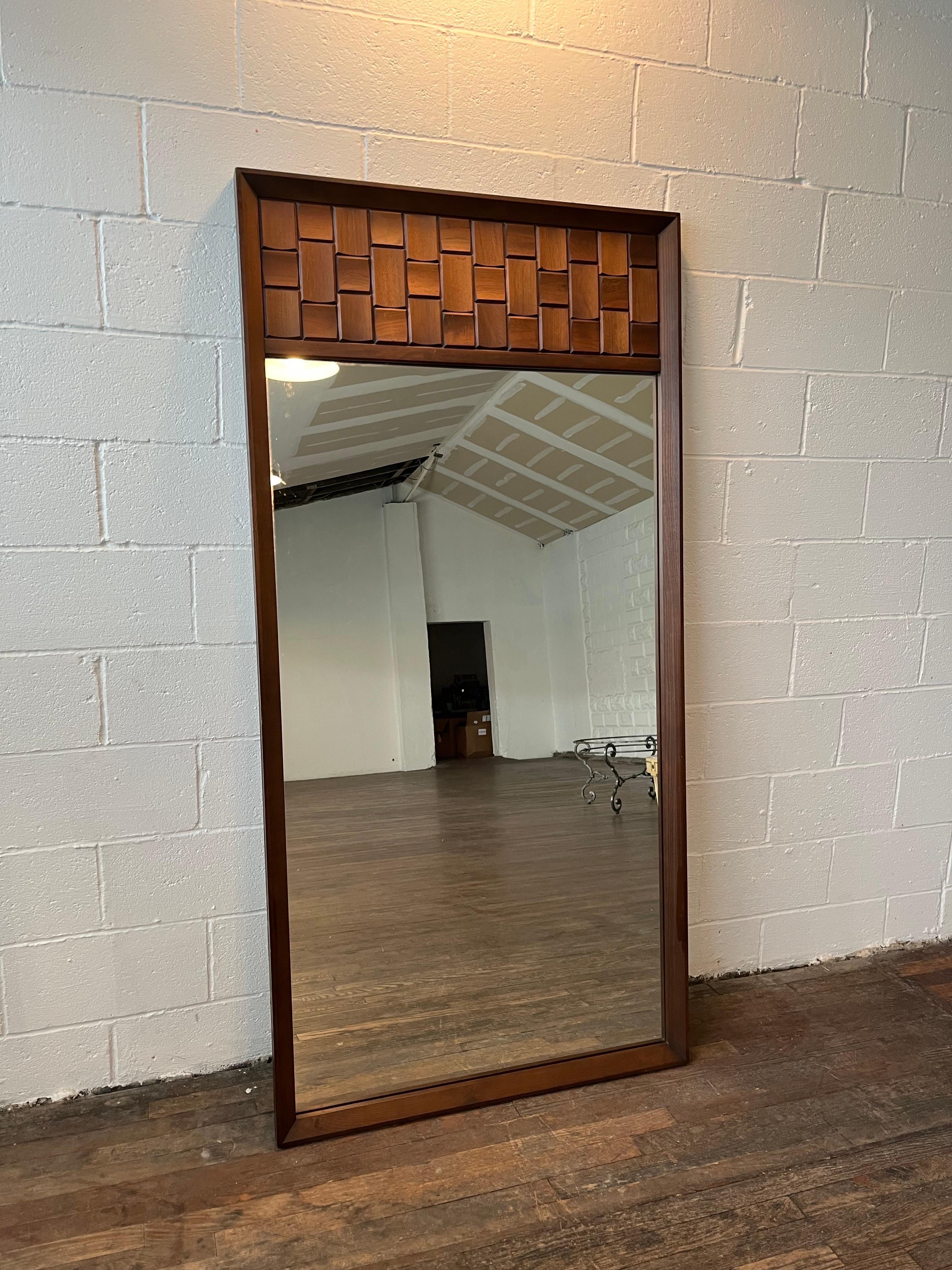 Vintage 1960s large walnut Brutalist style wall mirror by Tobago Furniture Co. The side of the mirror with the wood squares can be hung either on the left or the right. Walnut wood is a rich color. 
Curbside delivery to NYC/Philly $300