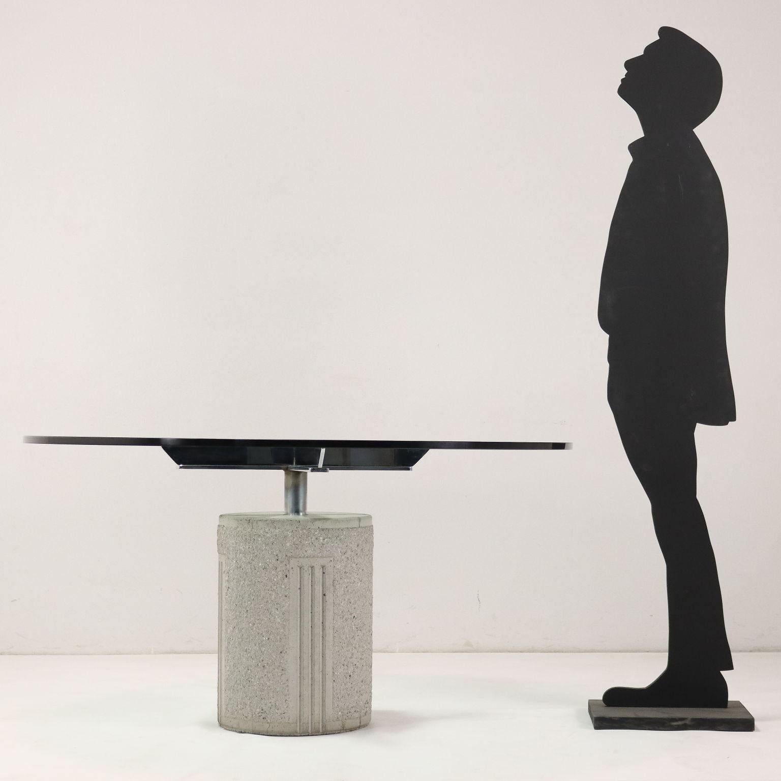 Table with concrete-granule base, chrome-plated metal frame and glass top.