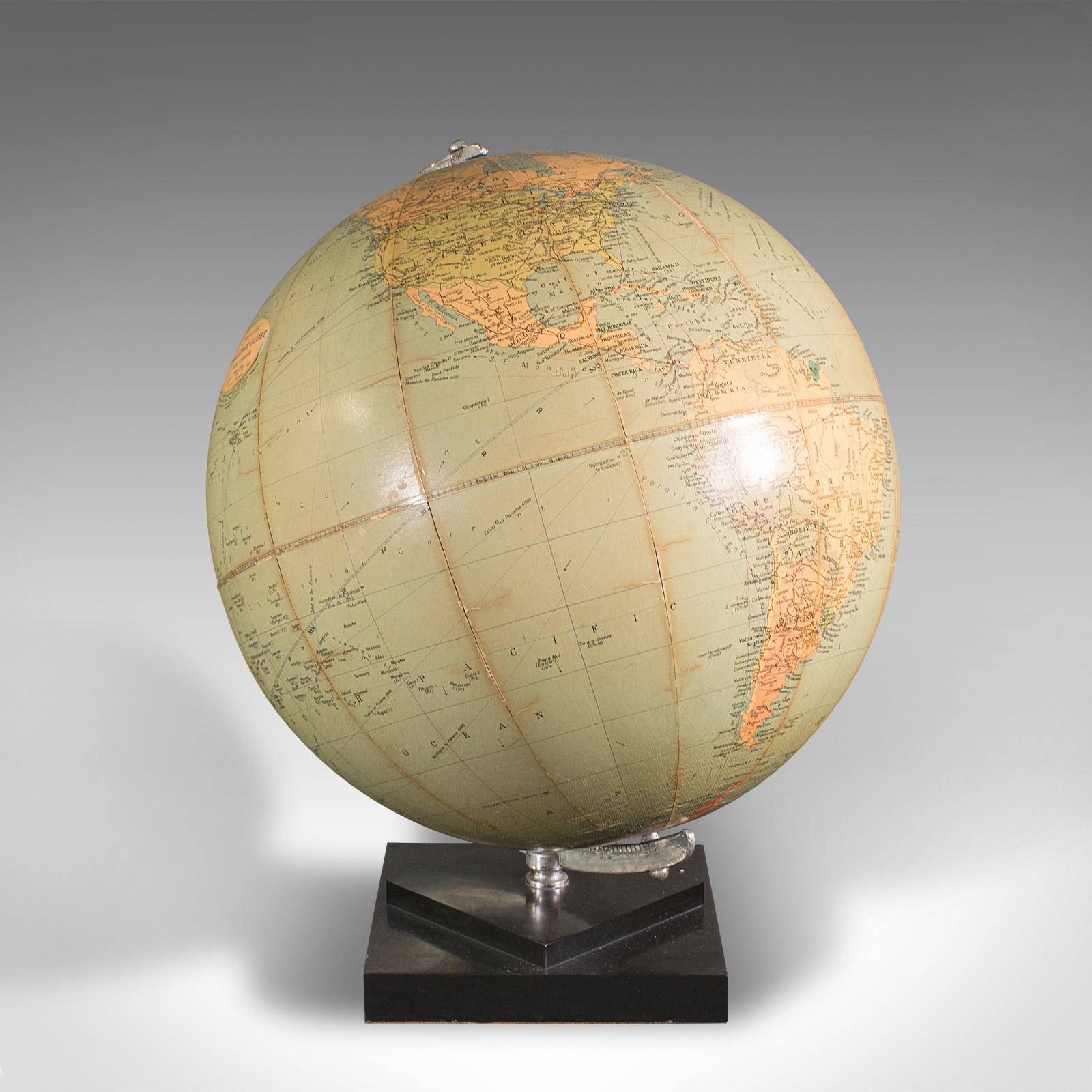 This is a vintage table globe. An English, paper finished world map with chrome meridian, dating to the mid 20th century, circa 1960.

Fascinating mid-century globe with a delightful level of detail
Displays a desirable aged patina throughout
Globe