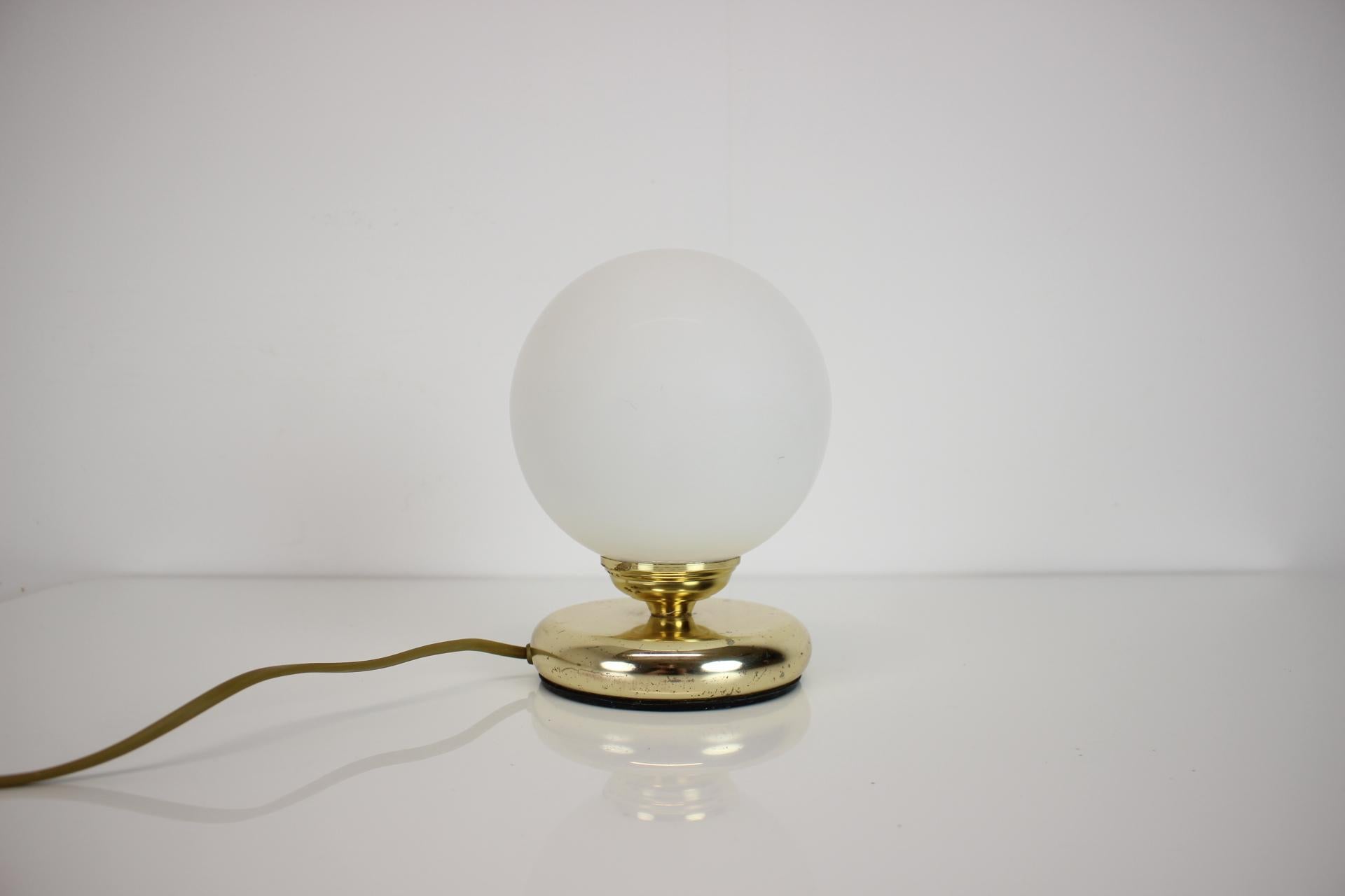Rare mid-century  table lamp, made in Germany, in the 1950's.
Made of glass and brass
Fully functional, repolished, cleaned, in original condition, with a few signs of use (shown in the pictures posted).