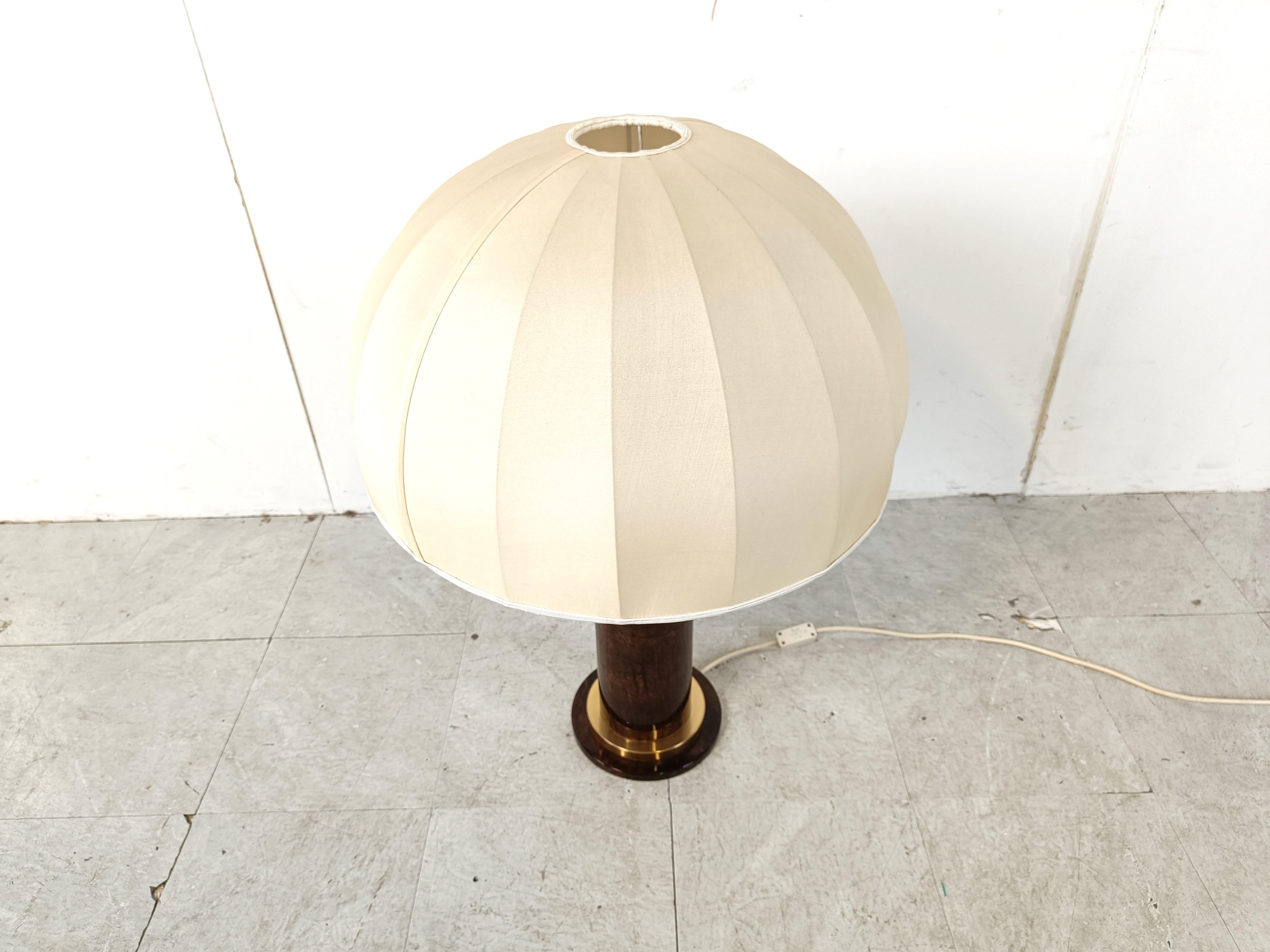 Rare mid century modern table lamp by Aldo Tura with its original lamp shade.

Made from brass and brown lacquered goatskin.

Labelled under the base.

Very good condition

1960s - Italy

Dimensions:
Height: 80cm
Diameter: 55cm

Ref.: 099930
