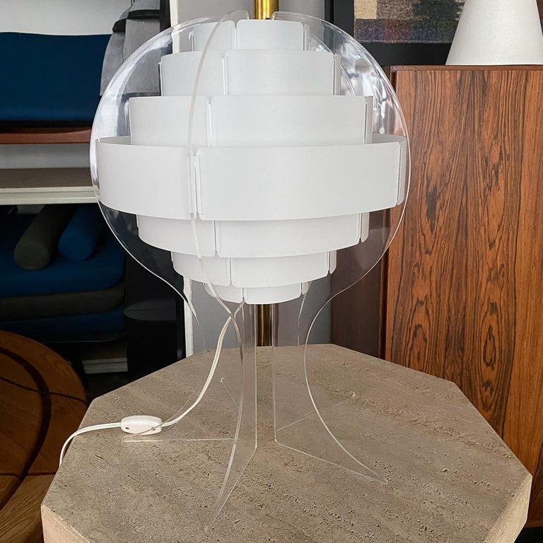 Table lamp, by Flemming Brylle and Preben Jacobsen.

 

Material: Acrylic base, plastic shade.

 

 

 

Origination: Denmark, 1960s

Condition: Very good, hardly any signs of use.

 

 

Approximate dimensions:

Height: 50