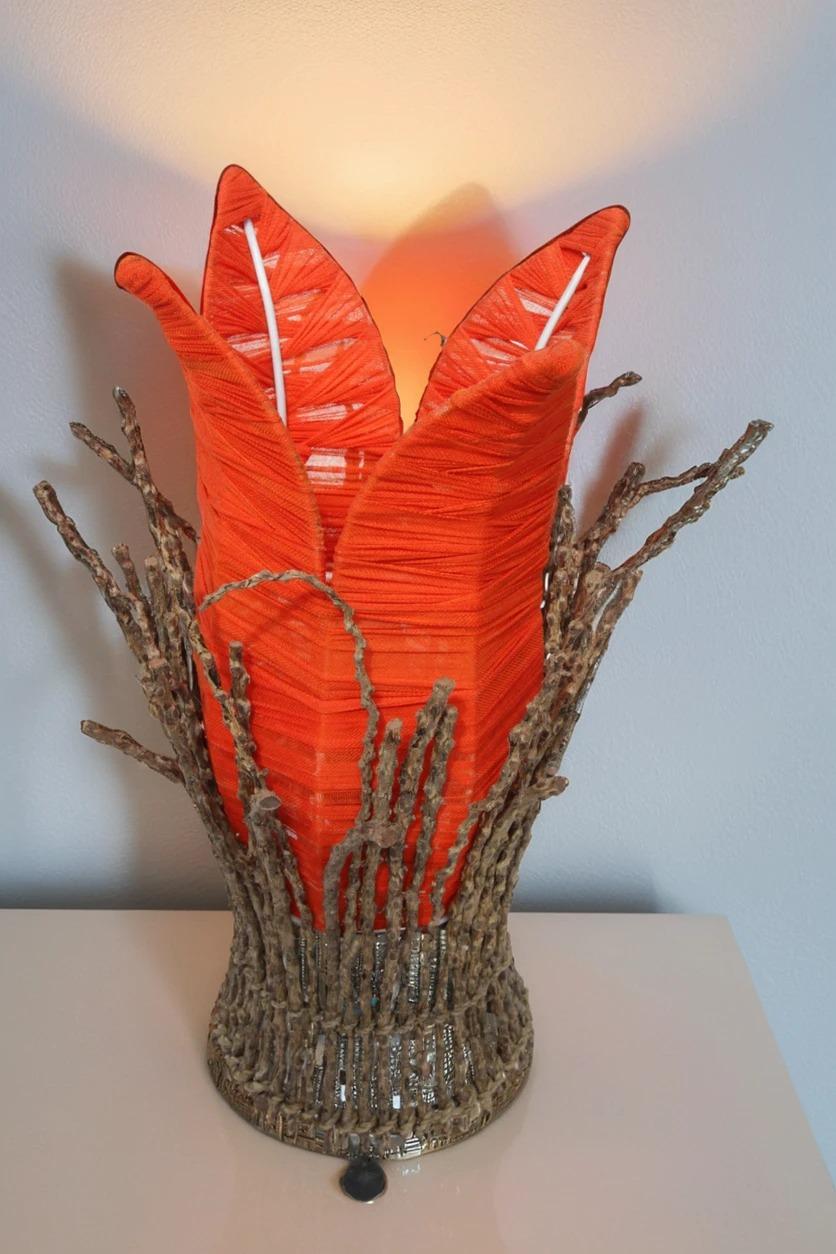 Decorative table lamp with artfully crafted aerial roots fabric weave. Lovers of natural materials will be delighted with this beautiful floor lamp. Apart from the metal body, the lamps are made entirely from natural materials. First, the metal body