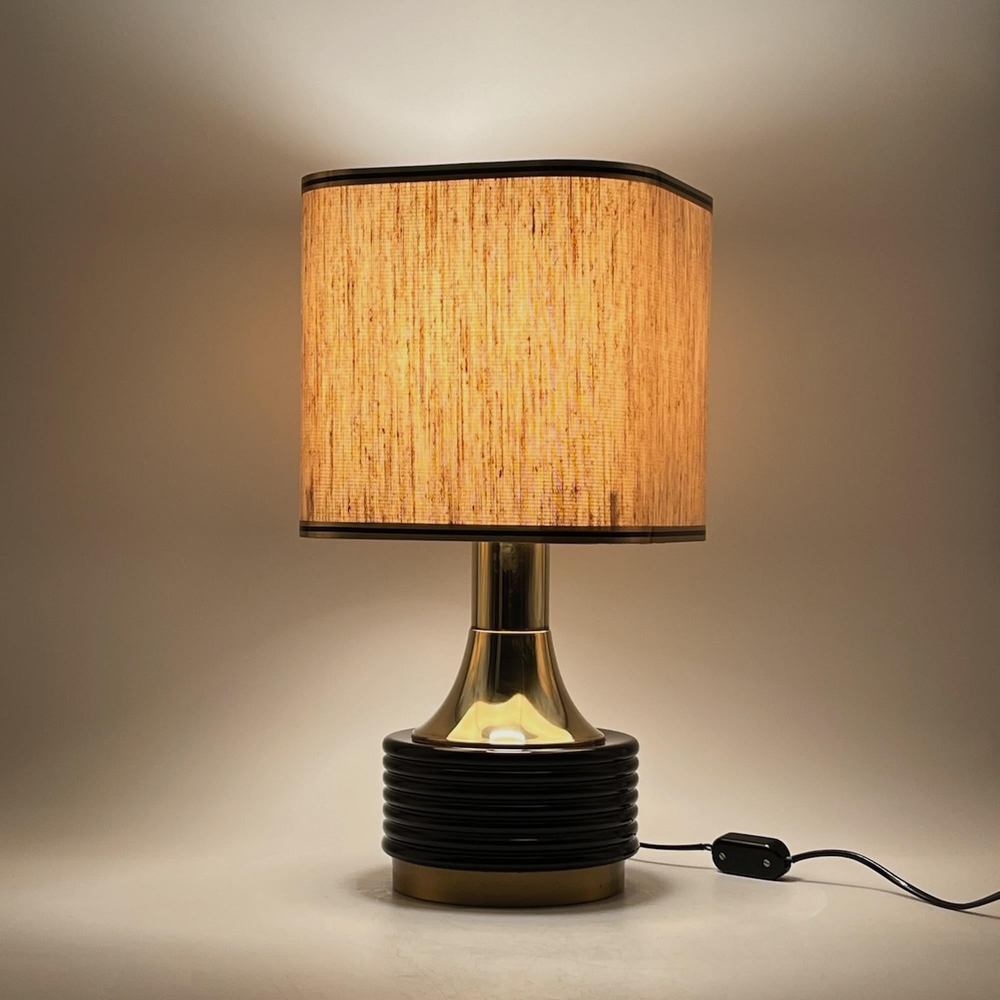 Immerse yourself in the timeless allure of 60s lamps with this exquisite Italian mid-century table lamp, crafted in the style reminiscent of design maestros Willy Rizzo and Tommaso Barbi. This large vintage lamp, originating from the 1960s, is a