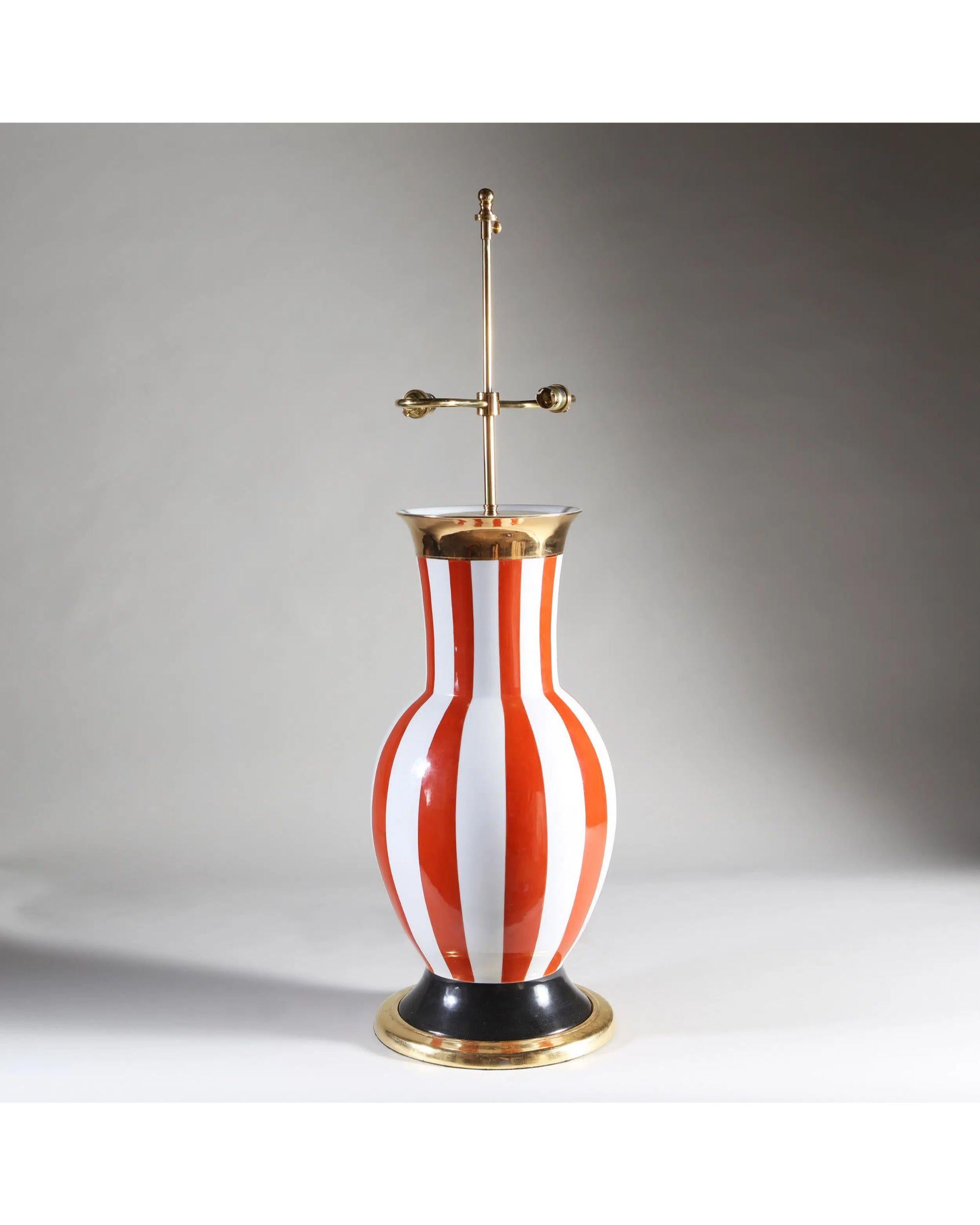 Table lamp by and signed Frédéric de Luca, Paris, 1985

A most unusual large scale porcelain vase decorated with gilt and bold red and white stripes, in a manner reminiscent of Commedia del Arte Arlequino.

Additional information:
Origins: