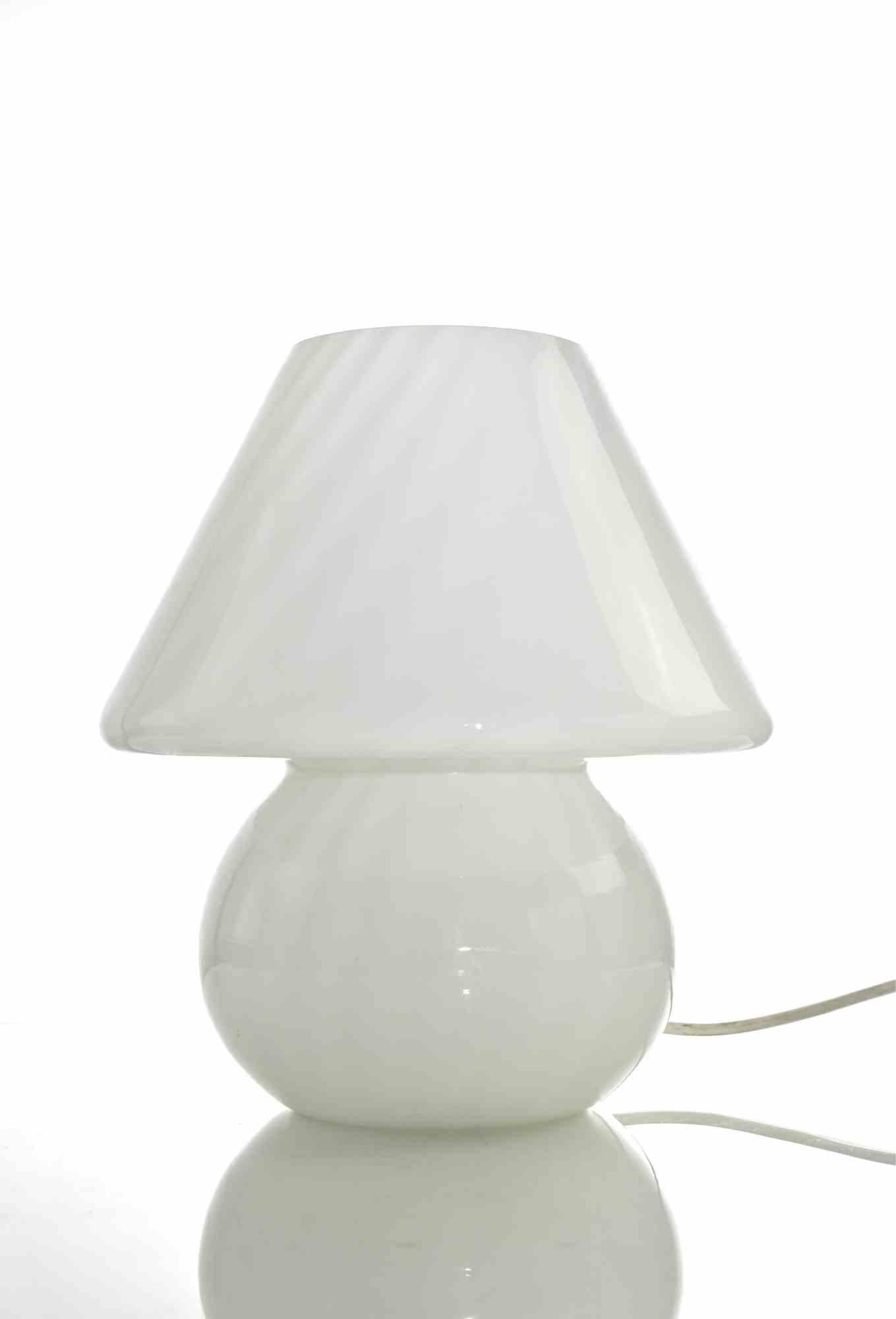 Vintage mushroom lamp in white glass, realized by Murano manufacture in 1970s.

Excellent condition.
