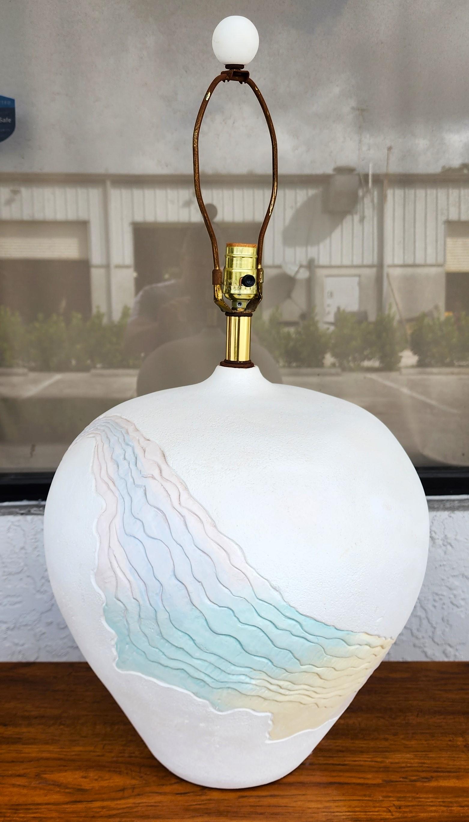 For FULL item description click on CONTINUE READING at the bottom of this page.

Offering One Of Our Recent Palm Beach Estate Fine Lighting Acquisitions Of A
1970's Southwestern Style Plaster Table Lamp Signed LEE REYNOLDS

We have many other