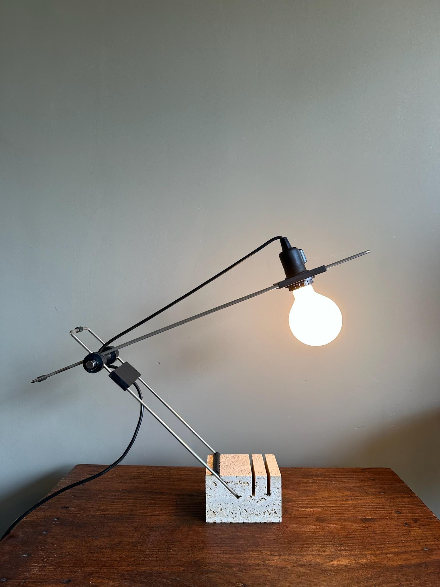 Vintage adjustable table lamp with a foot made out of travertine.

Adjustable in height.

Height 78 cm
Width 40 cm
Depth 10 cm

In a good vintage condition, minor wear and tear due to age.