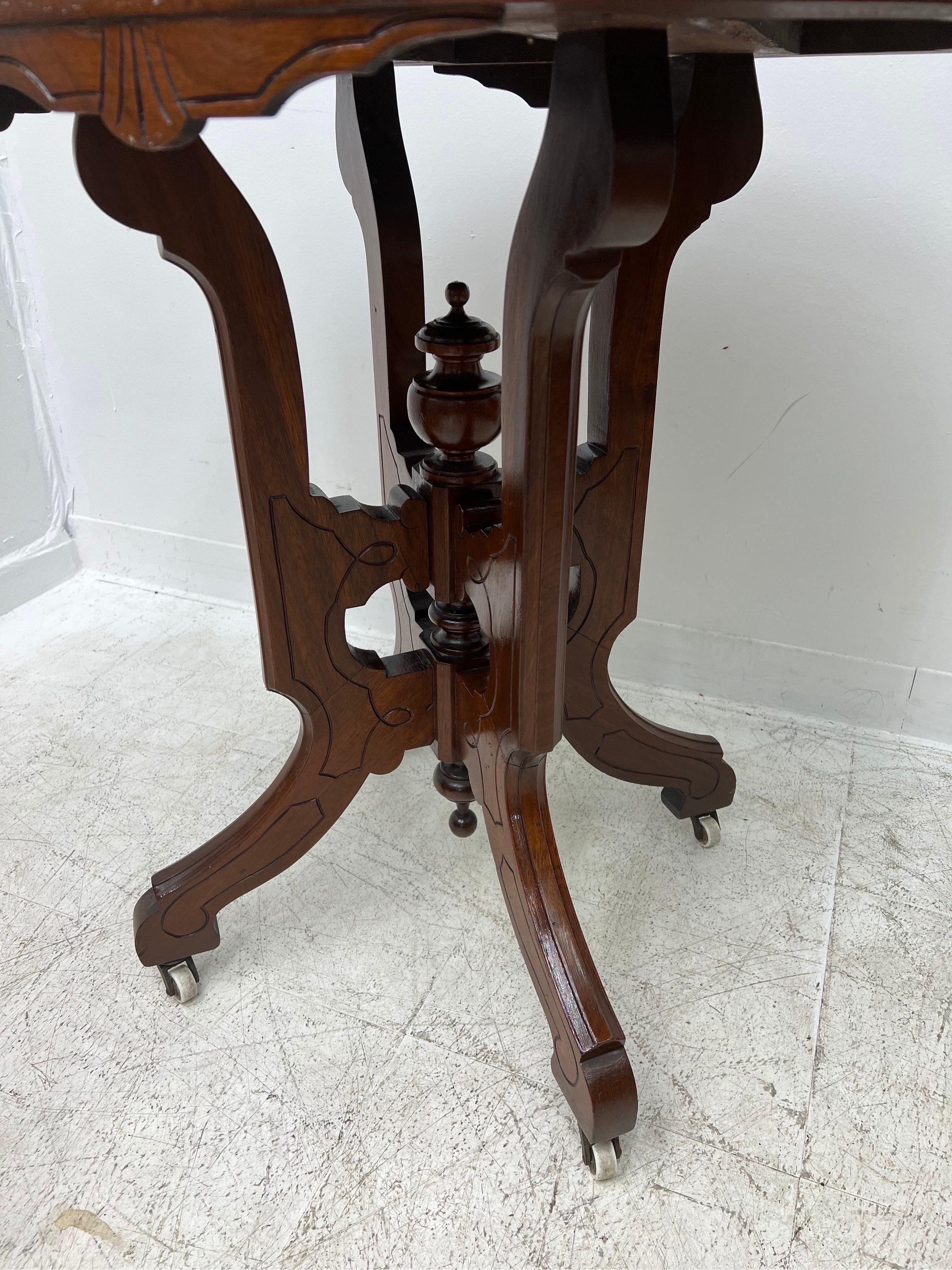 Vintage table stand on casters 
Dimensions. 30 1/2 W ; 29 1/2 H ; 22 D.