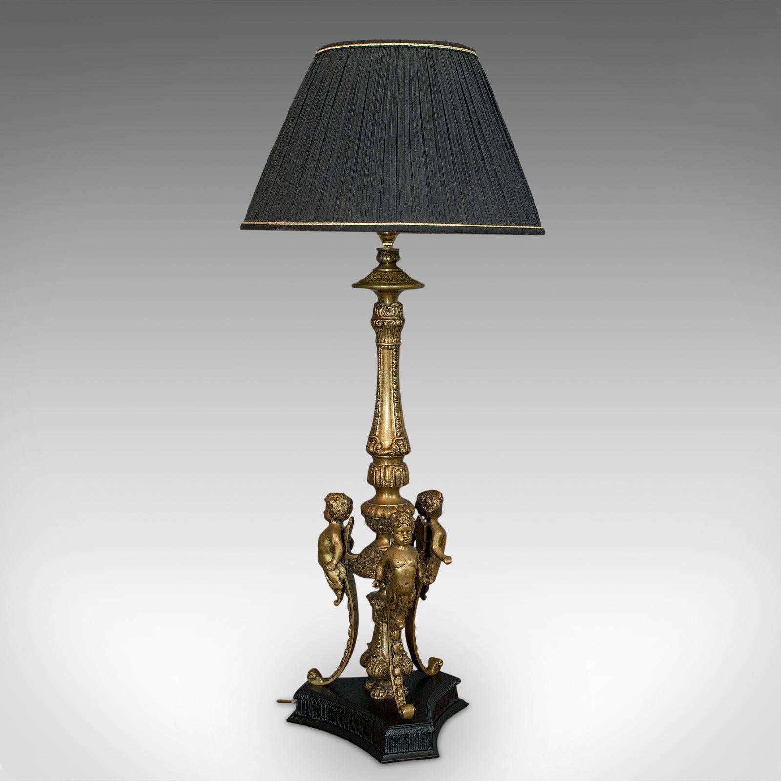 This is a table lamp. An English, gilt metal cherubic light, dating to the late 20th century, circa 1990.

Attractive golden tones
Displays a desirable aged patina
Gilt metal in good order with fine detail
Appealing, consistent colour