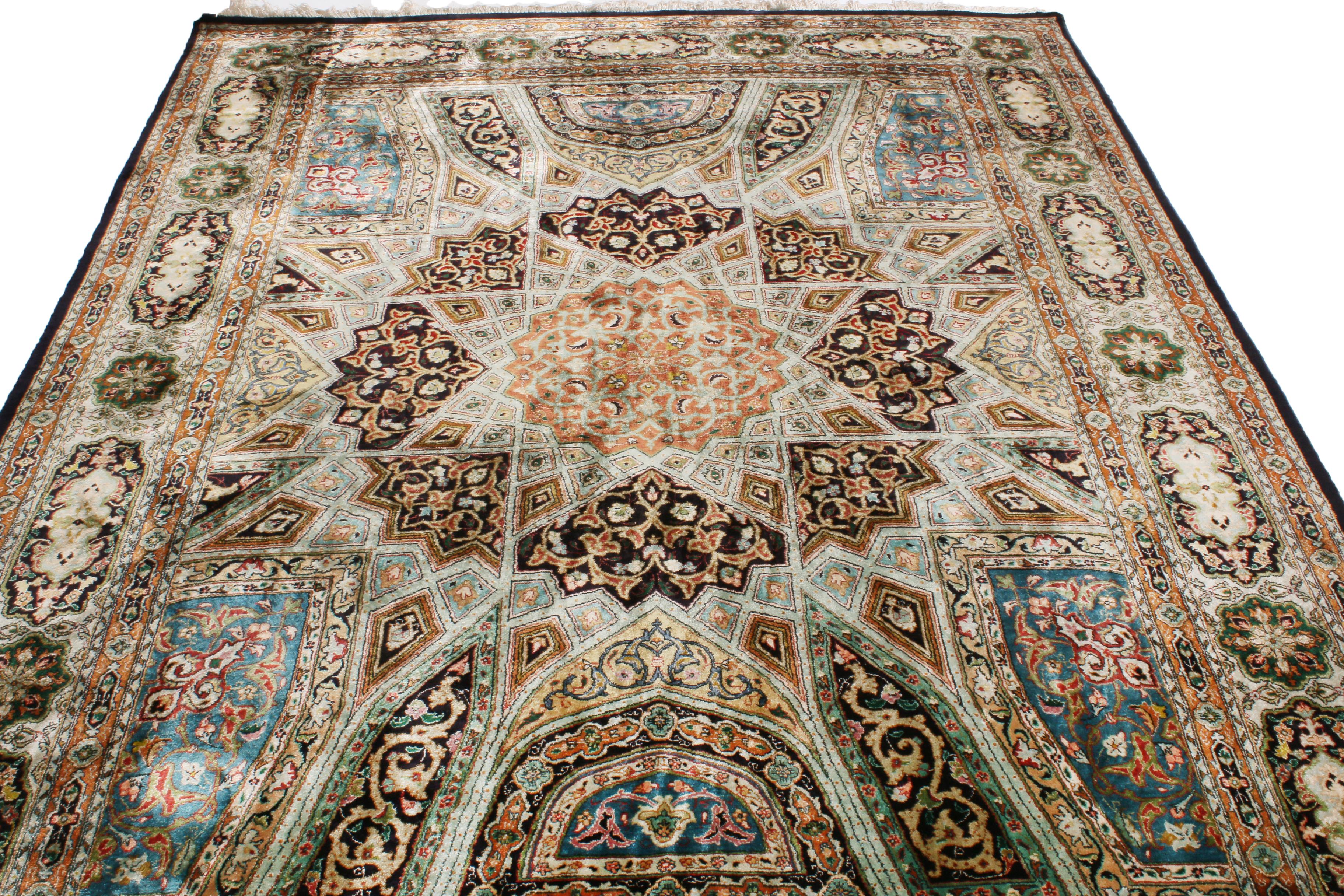 Hand knotted with a bold, luminous silk originating from Persia between 1920-1940, this vintage Tabriz Persian rug enjoys one of the most interestingly graphed drawings with a variety of symbolic interpretations. Complemented by both versatile and