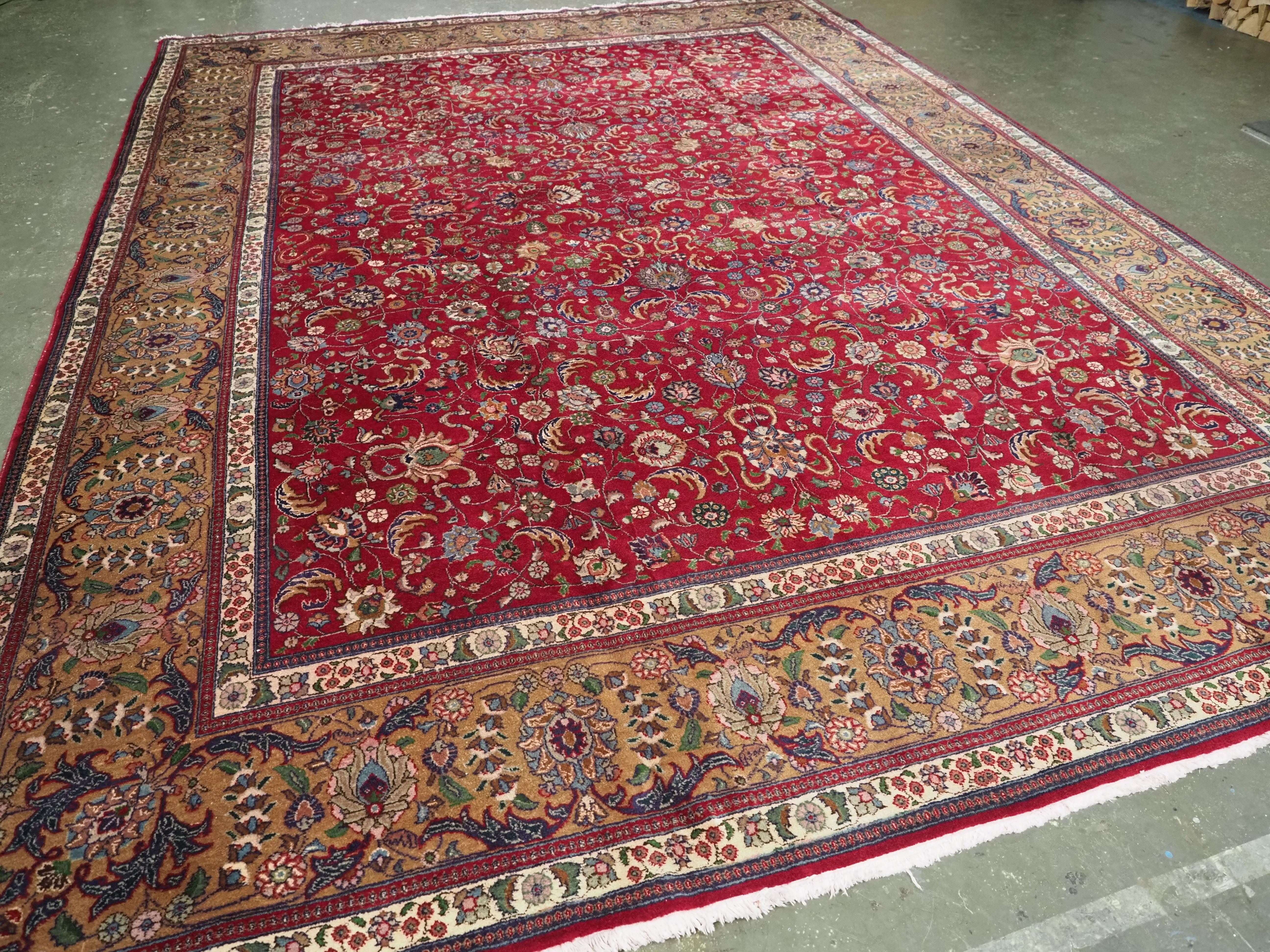 Size: 14ft 11in x 11ft 0in (455 x 336cm).

Vintage Persian Tabriz carpet of traditional all over design in a large room size.

Circa 1930.

A very good furnishing Tabriz carpet with a traditional all over floral design. The carpet has a good ruby