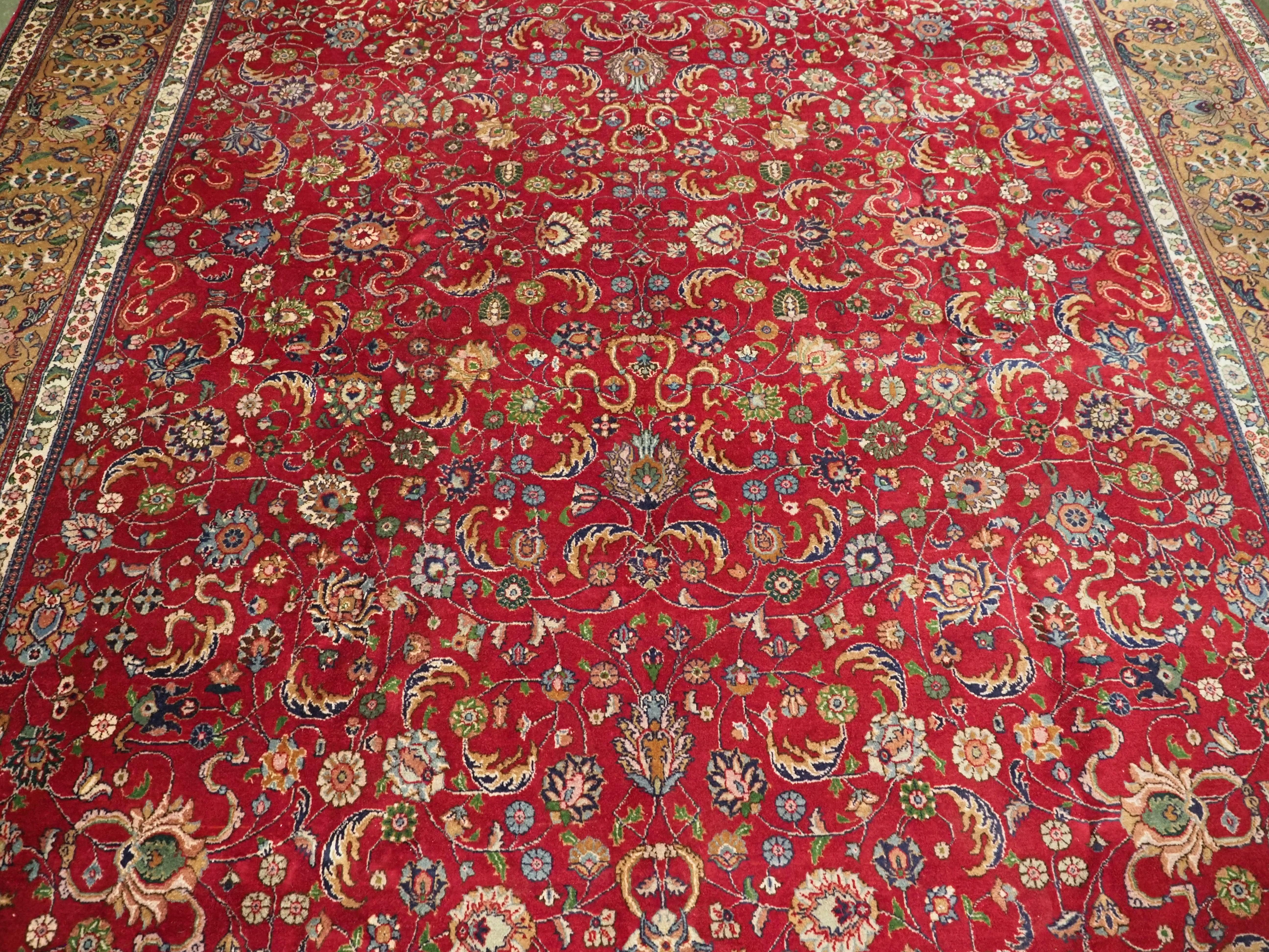 Vintage Tabriz carpet of traditional all over design in large room size. In Good Condition For Sale In Moreton-In-Marsh, GB
