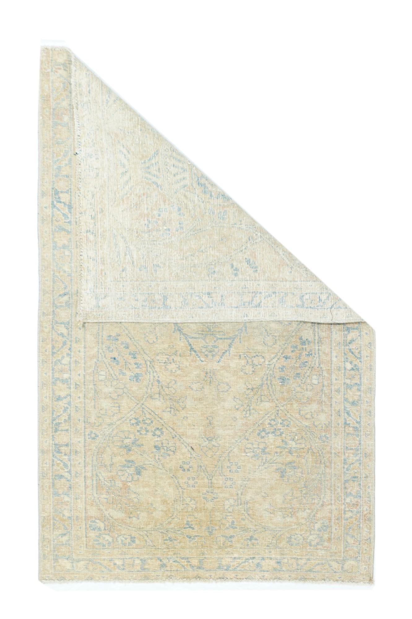 Vintage Tabriz rug 2'4'' x 4'. The evenly and almost distressed urban scatter is one of a pair, and shows a straw-rust field with lateral helix flowering branches, around a large, central light blue medallion. Light blue border of palmettes and