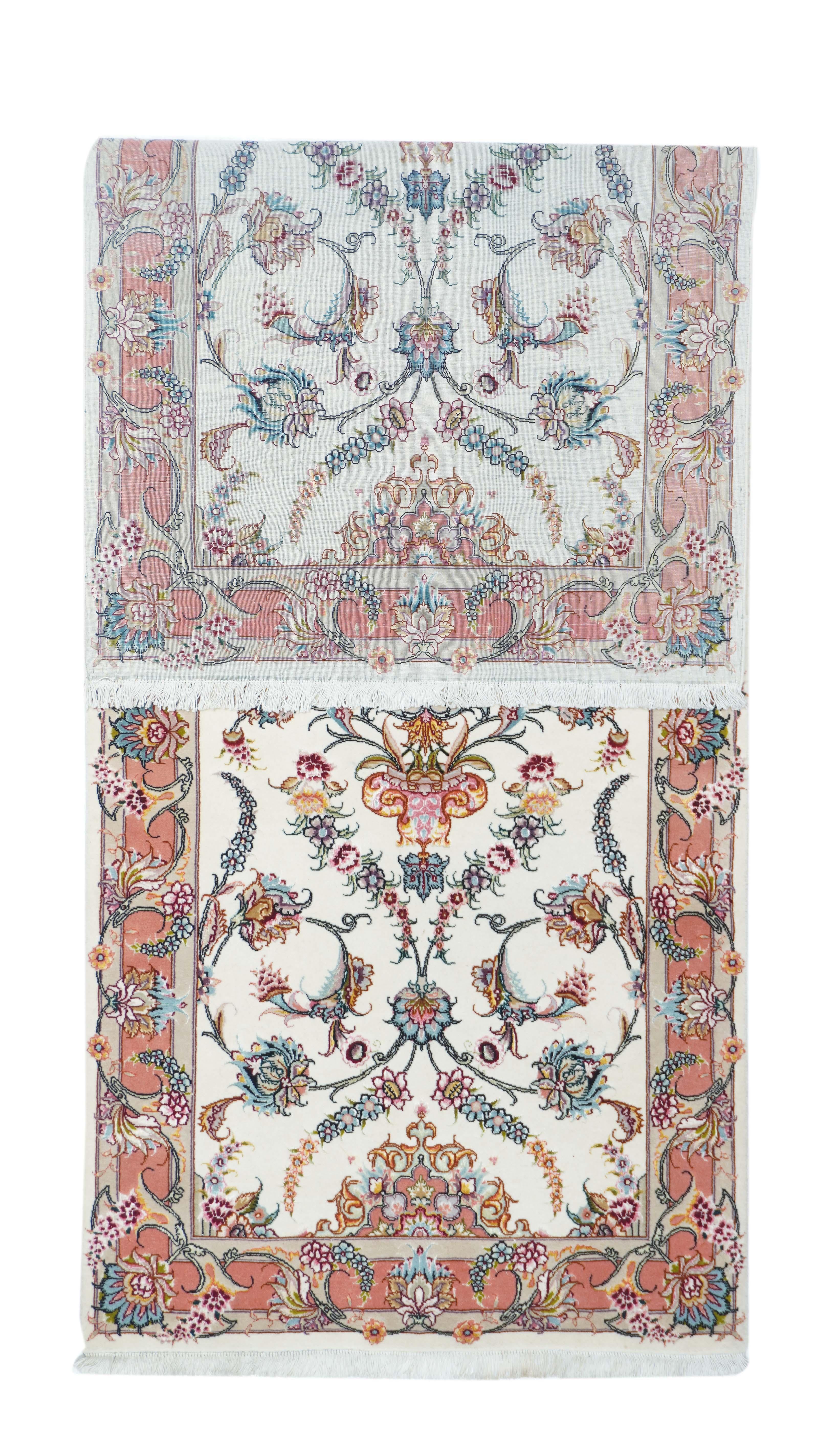 Vintage Tabriz rug 2'9'' x 7'8''. The wool pile is accented in silk. The off white field shows a small octilobe medallion organizing racemes, palmettes, coiling vinery and openwork palmettes. Beige broken border with racemes and palmettes. Cotton
