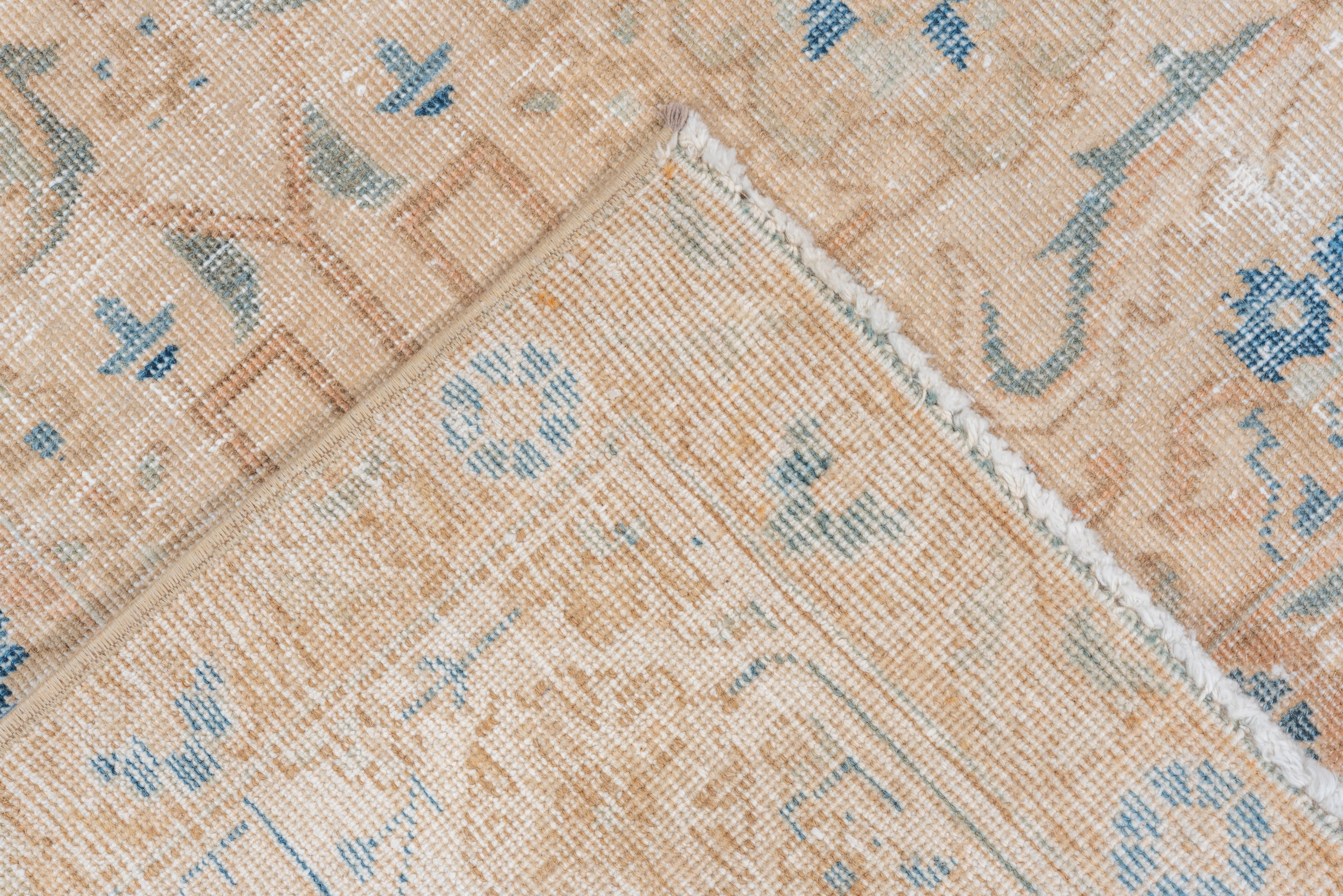 20th Century Vintage Tabriz Rug faded floral medallion in sand and blue For Sale