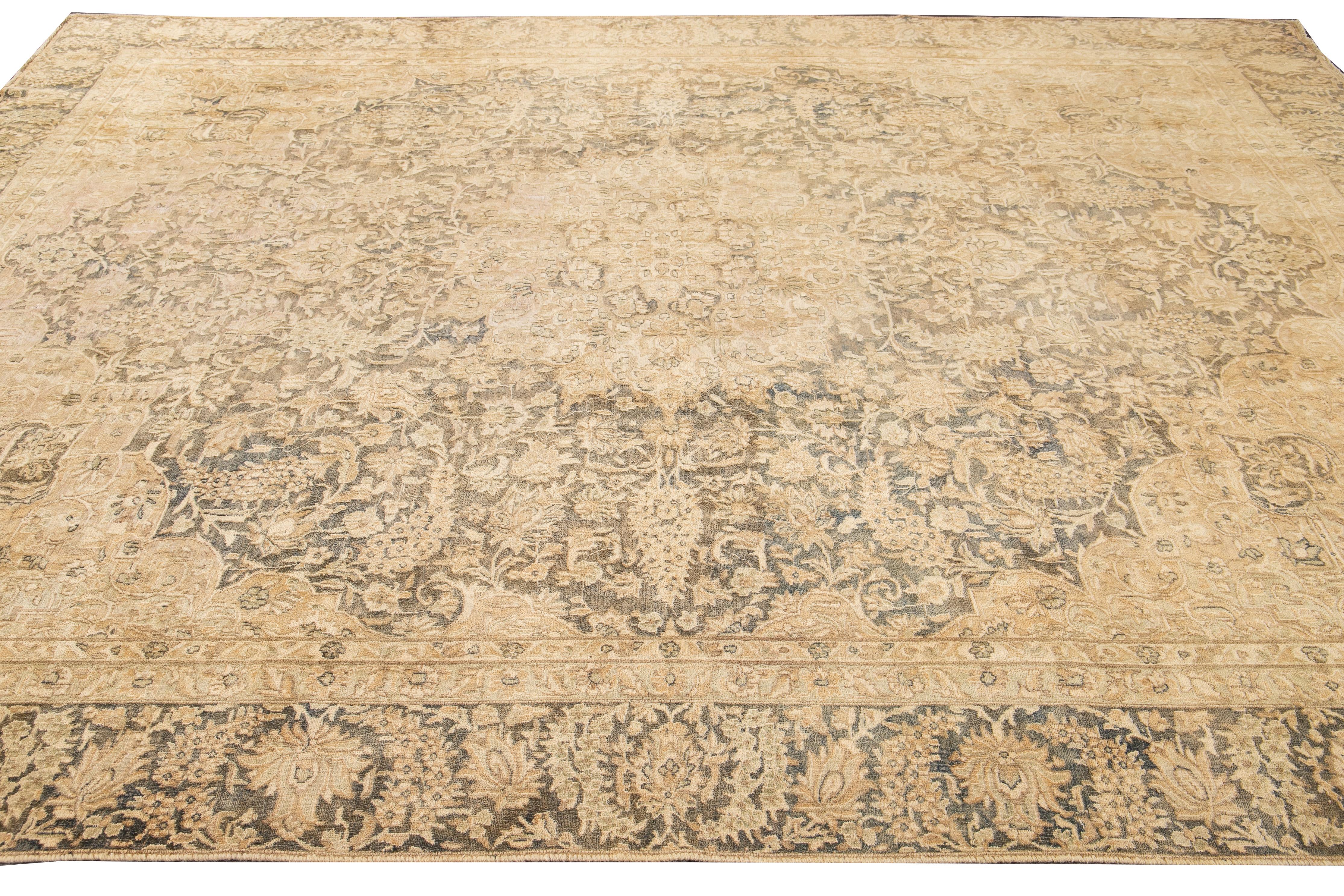 Beautiful antique Tabriz rug with a yellow field and gray accents with a medallion design in the center. 

This rug measures 9' 1