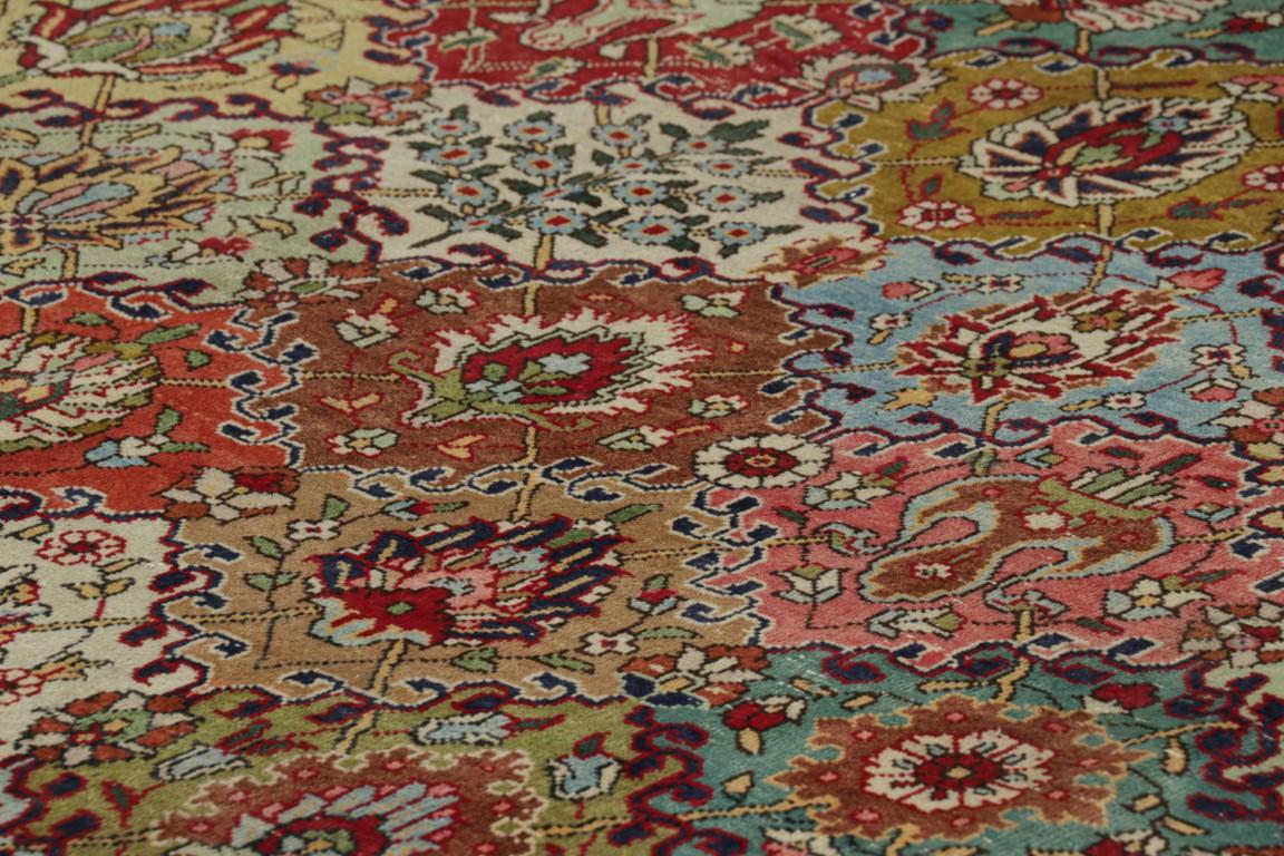 Made with hand-knotted wool and originating circa 1970-1980, this 10x13 vintage Tabriz rug represents a distinguished addition to Rug & Kilim's vintage collection—an exemplar of the legendary Tabriz weaving tradition. 

On the Design: 

Admirers of