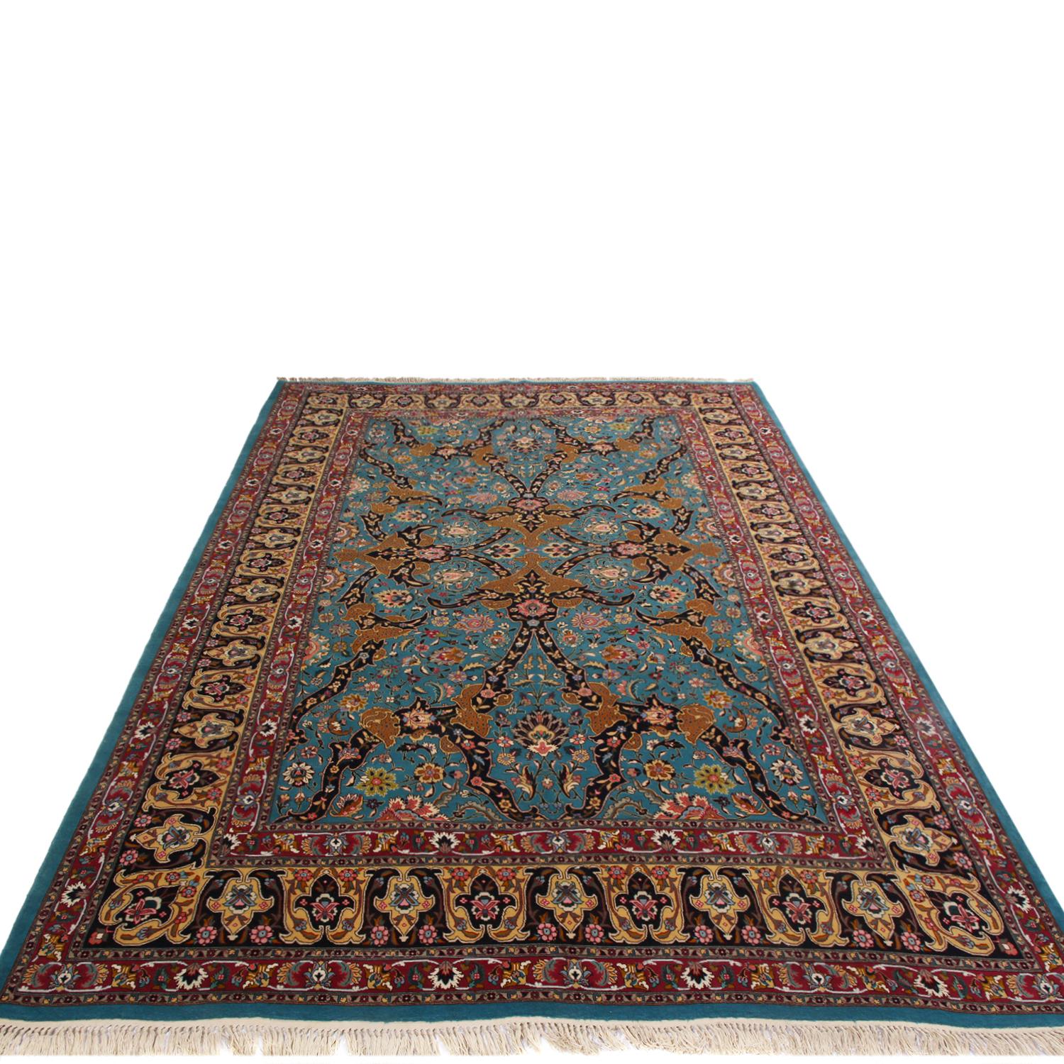 Hand knotted in high-quality wool originating from Persia between 1930-1940, this vintage Tabriz Persian rug hails from one of the most acclaimed carpet-making cities of the region, boasting a sharpness of detail in the mirrored borders and field