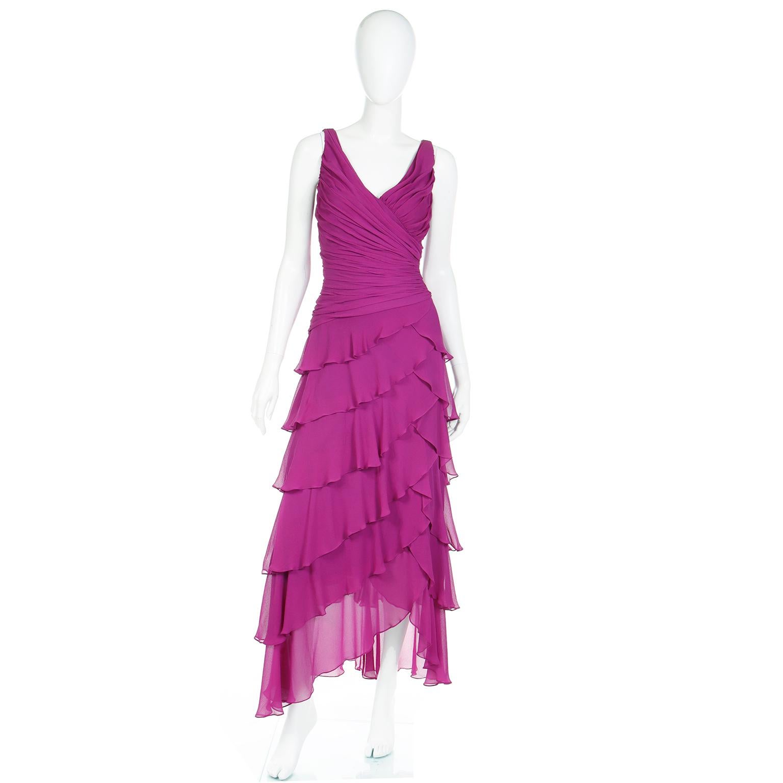 Tadashi Shoji made some gorgeous evening gowns and we particularly love the ones he designed in the 1980's and 1990's. We have sold so many of his dresses and the vintage pieces seem to be timeless. This ethereal vintage dress is in a pretty magenta
