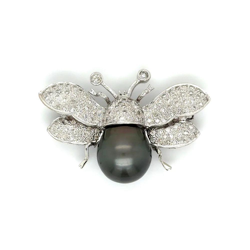 Simply Beautiful! Fabulous Vintage Bumble Bee Brooch, 1.00tcw Hand set Diamonds, enhancing the Wings and Body and featuring a Tahitian South Sea Pearl. Hand crafted in 14K White gold. Measures approx. 1.1” L x 1.6” W and weighing approx. 13.5g. More