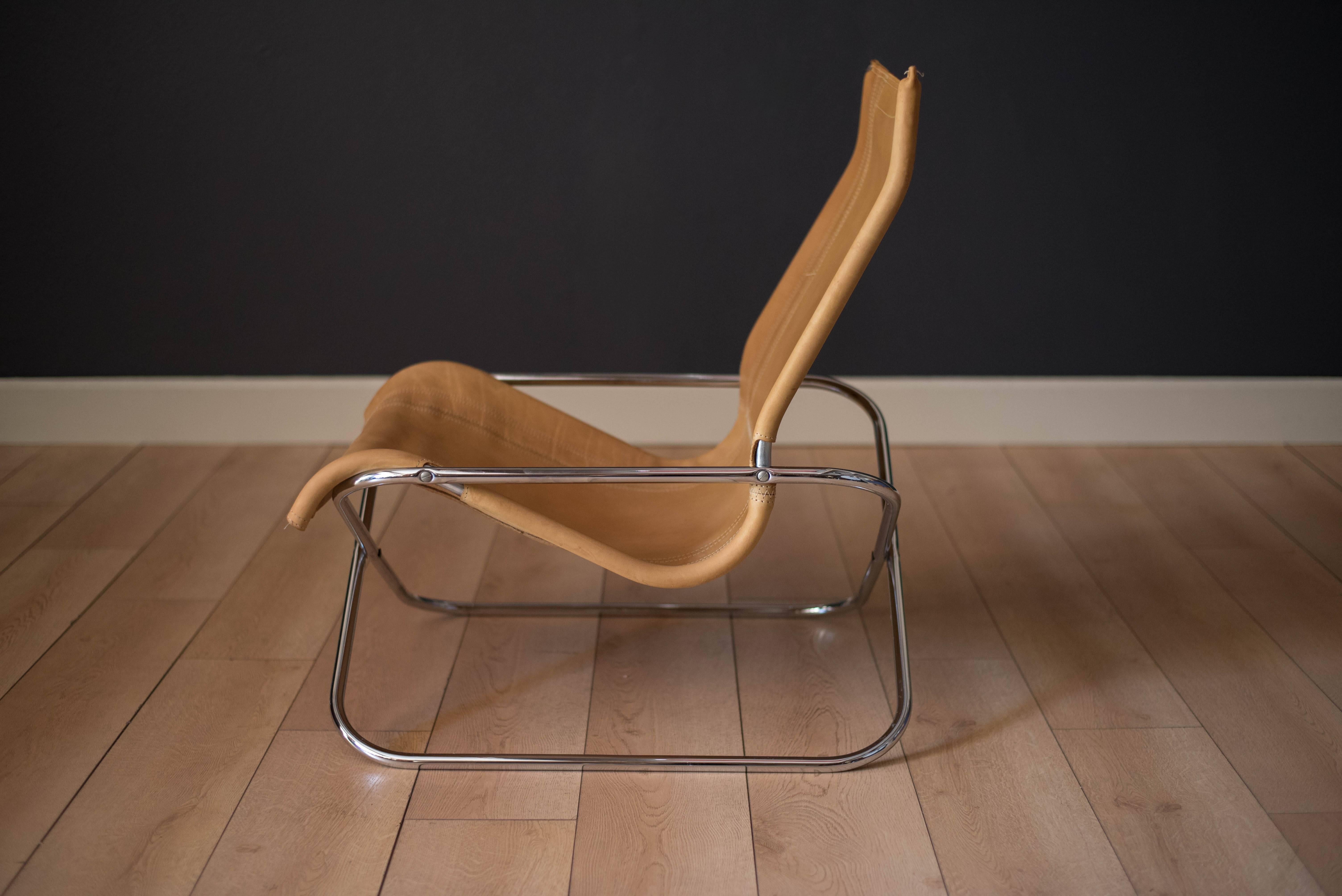 Mid-Century Modern director designed lounge chair by Takeshi Nii, circa 1970s. This low sling chair is made of strong buffalo leather supported by a chrome X-base.