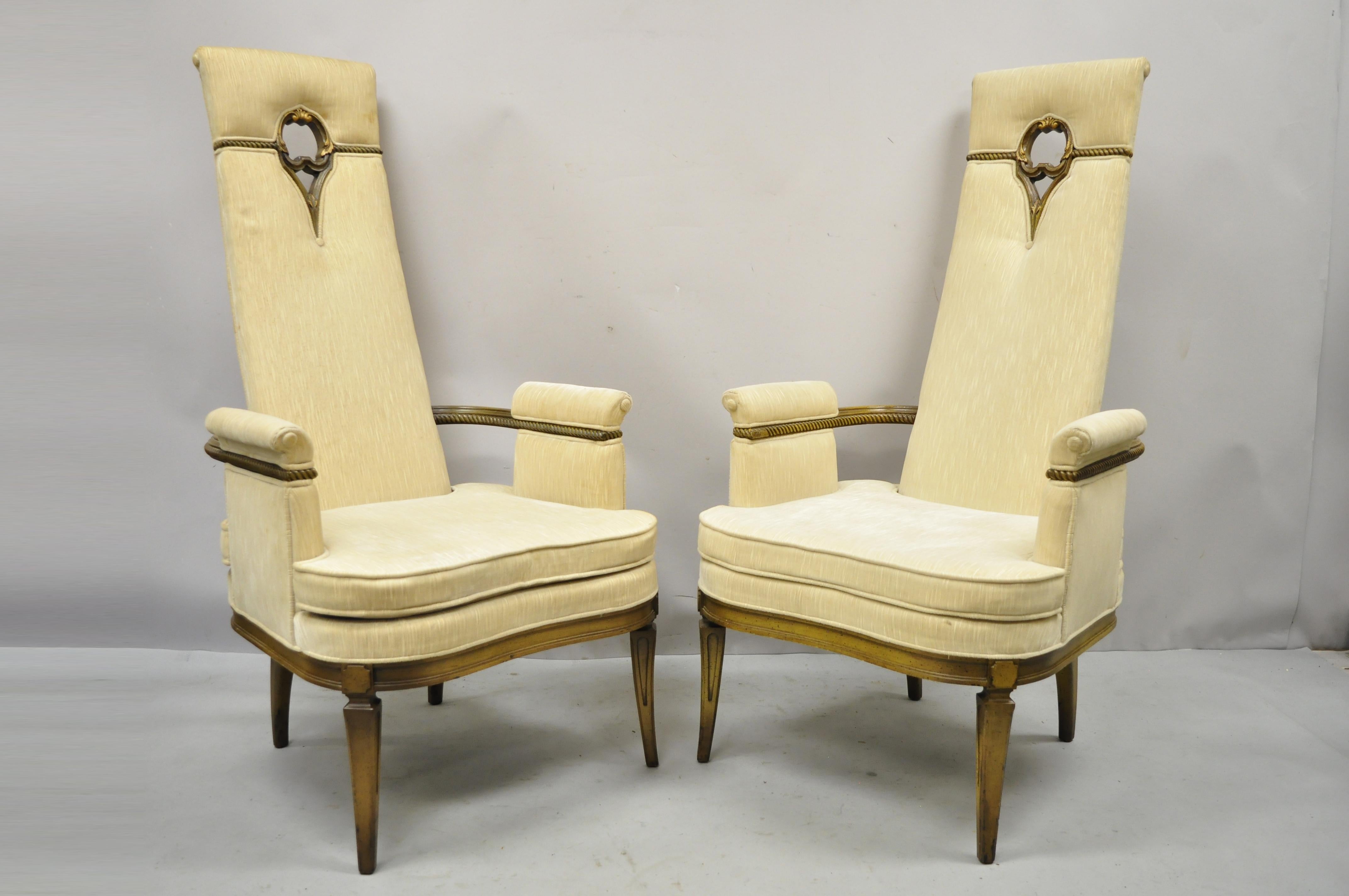 Vintage tall back Italian French Hollywood Regency lounge arm chairs - a Pair. Item features tall narrow backs with pierce carved wood cutouts, solid wood frames, upholstered arm rests, tapered legs, very nice vintage pair, great style and form,