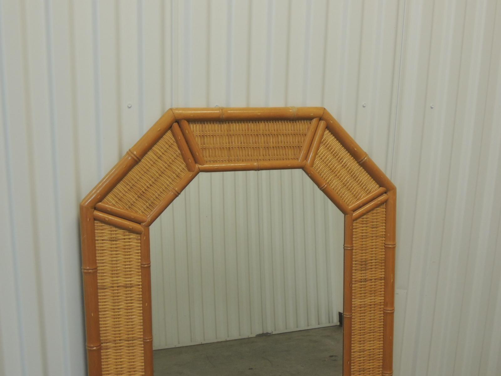 Vintage tall octagonal shape bamboo mirror,
with woven rattan inset panels. Wooden back
and hanging wire.
Measures: 27 x 48 x 1.5