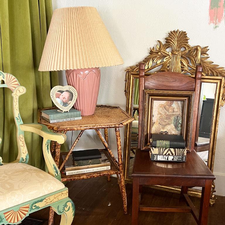 A pastel blush pink art deco ceramic table lamp. This piece will be a great addition to a grand millennial style home. It is tall and demands attention! It features an art nouveau or art deco style texture around the base which seems to also look