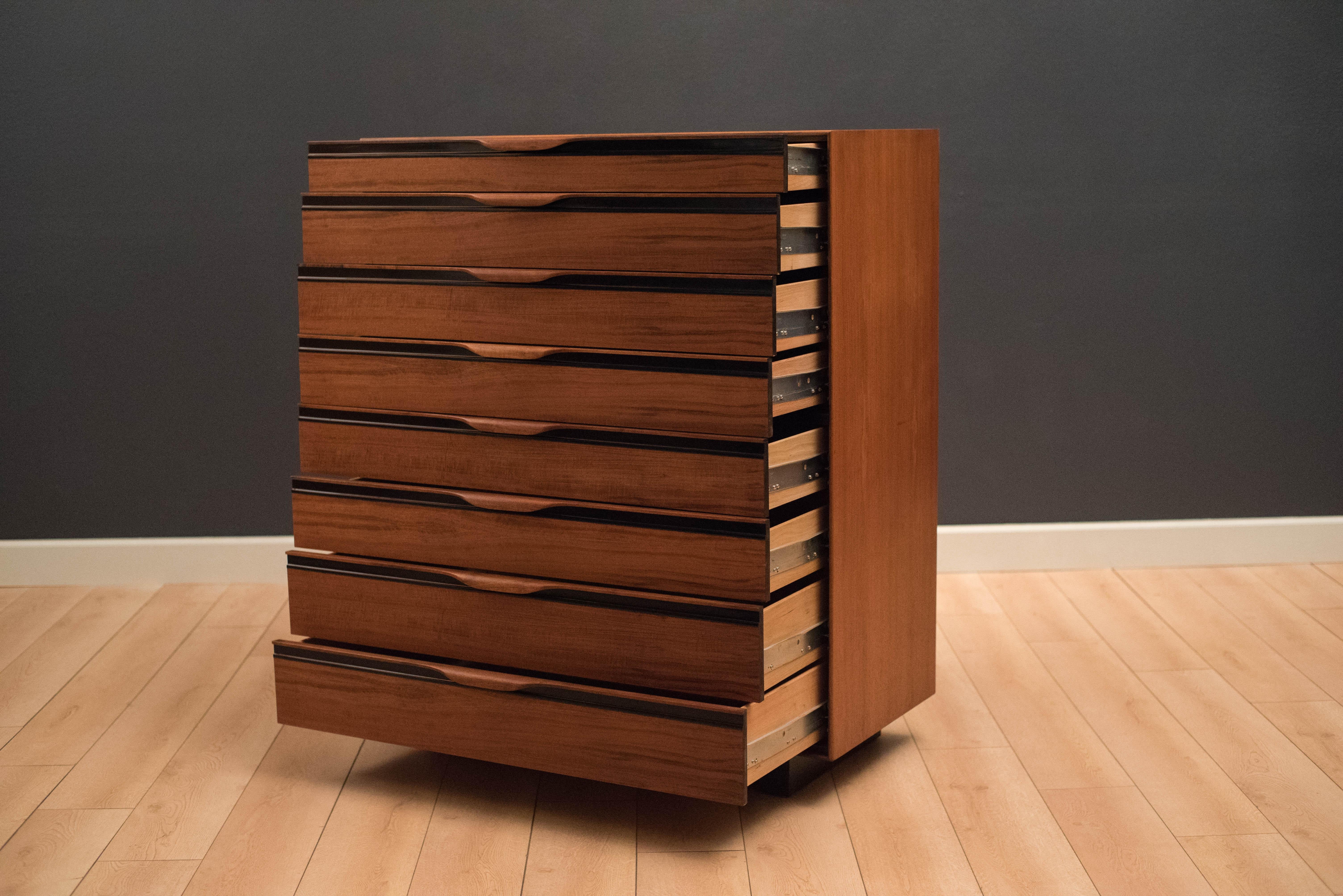 Mid-Century Modern highboy dresser chest designed by John Kapel for Glenn of California in walnut. This piece is equipped with eight storage drawers that glide smoothly on metal slides. Matching pair of nightstands available in separate listing.