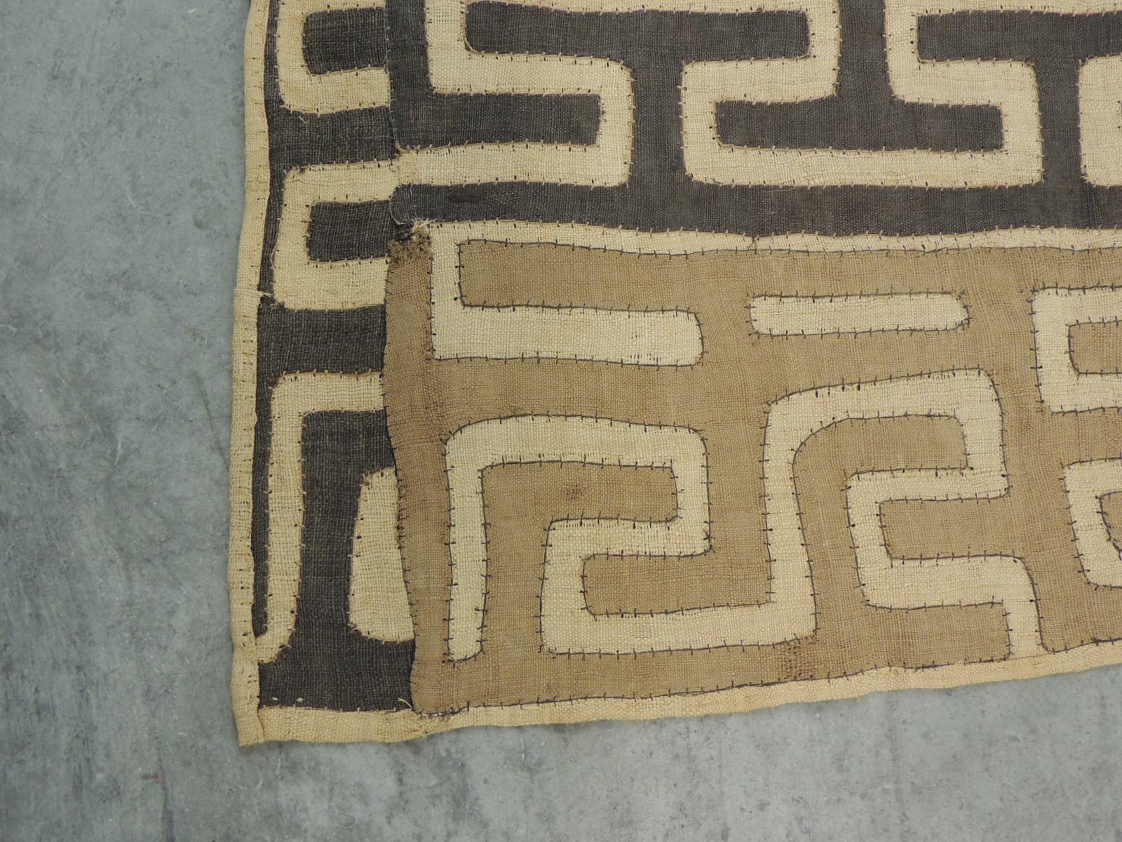 Vintage tan and brown Earth tones African applique Kuba applique textile fragment.
Patchwork and embroidered applique design and tribal woven pattern.
In shades of brown, black, camel, taupe and soft yellow.
Ideal to hang on the wall or make into