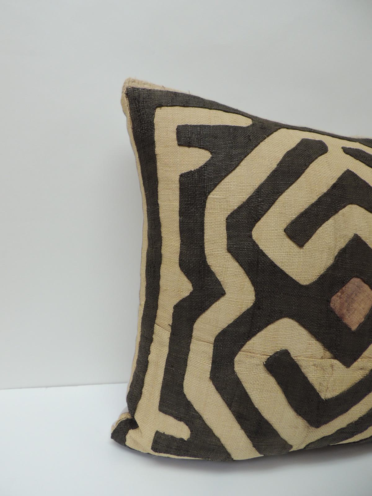 Tribal design textile on African Raffia textured finished pillows with basket weave jute trim details. Handcrafted and designed in the USA.
Custom made pillow insert.
Handstitched (no zipper.) Brown center medallion and stone grey linen backing,