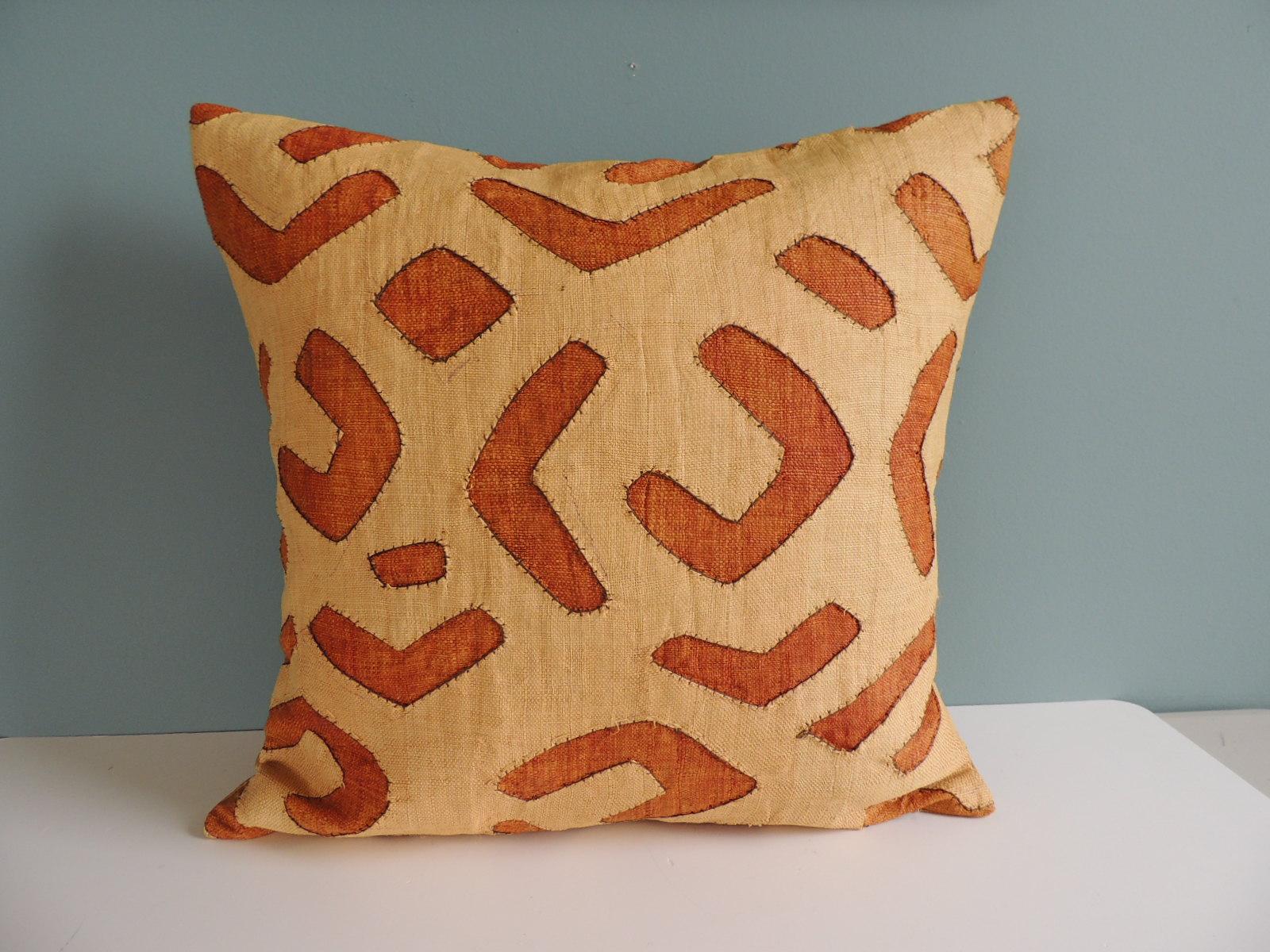 Vintage Tan and Camel African Raffia Kuba Textile Square Decorative Pillow with golden silk backing.
Decorative pillow handcrafted and designed in the USA.
Closure by stitch (no zipper closure) with custom-made feather/Down pillow insert.
Offered By