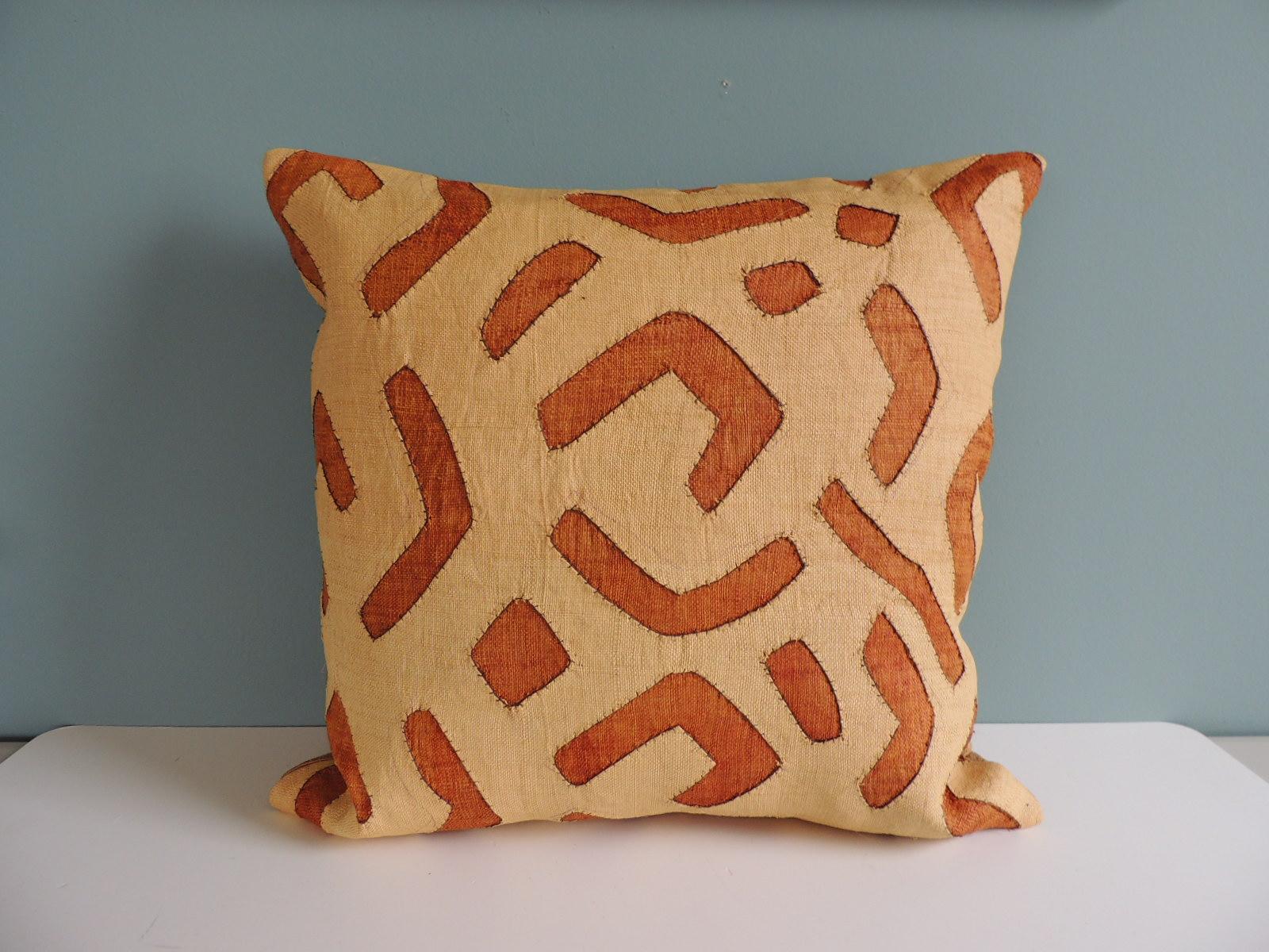 Vintage Tan and Camel African Raffia Kuba Textile Square Decorative Pillow with golden silk backing.
Decorative pillow handcrafted and designed in the USA.
Closure by stitch (no zipper closure) with custom-made feather/Down pillow insert.
Offered By