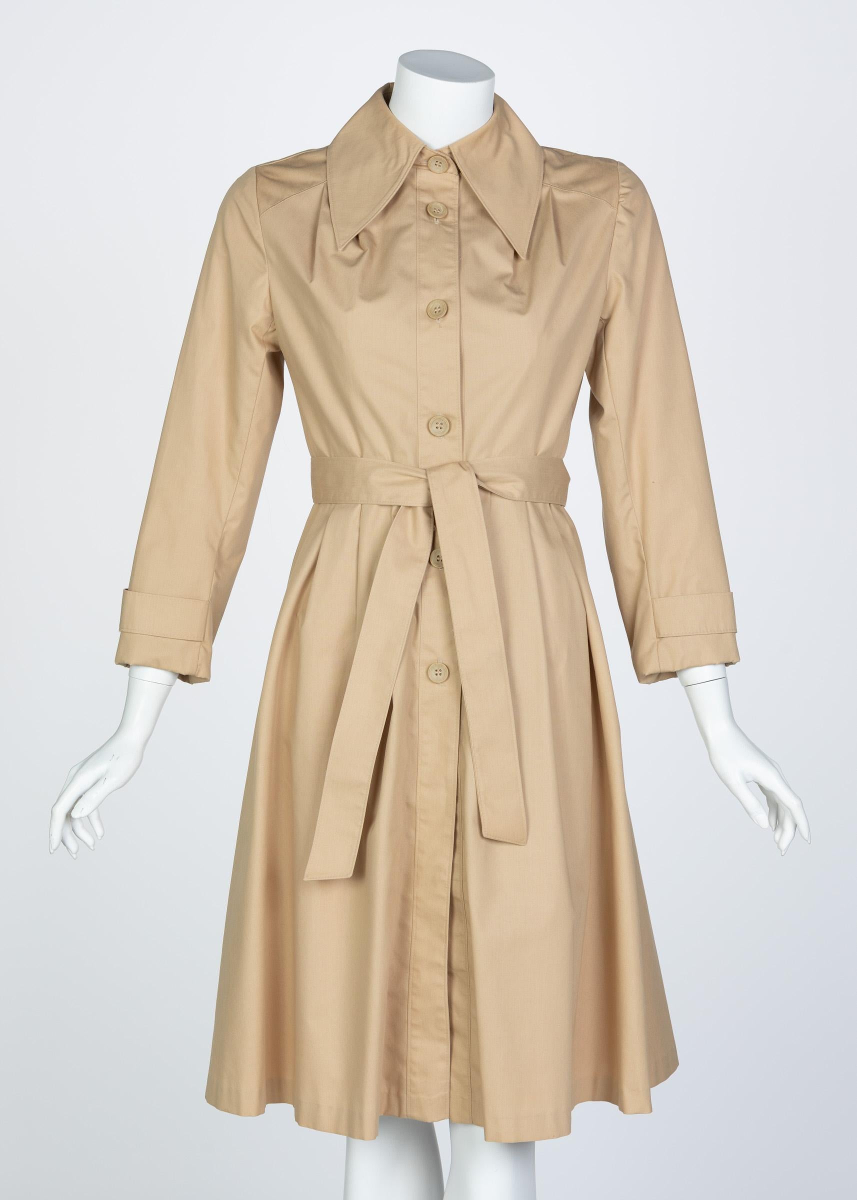 The trench coat is a modern staple. Rising to popularity during mid century wartime, the coat has since become a timeless silhouette that continues to be rehashed and remixed for new tastes and preferences. This vintage trench us done in a classic