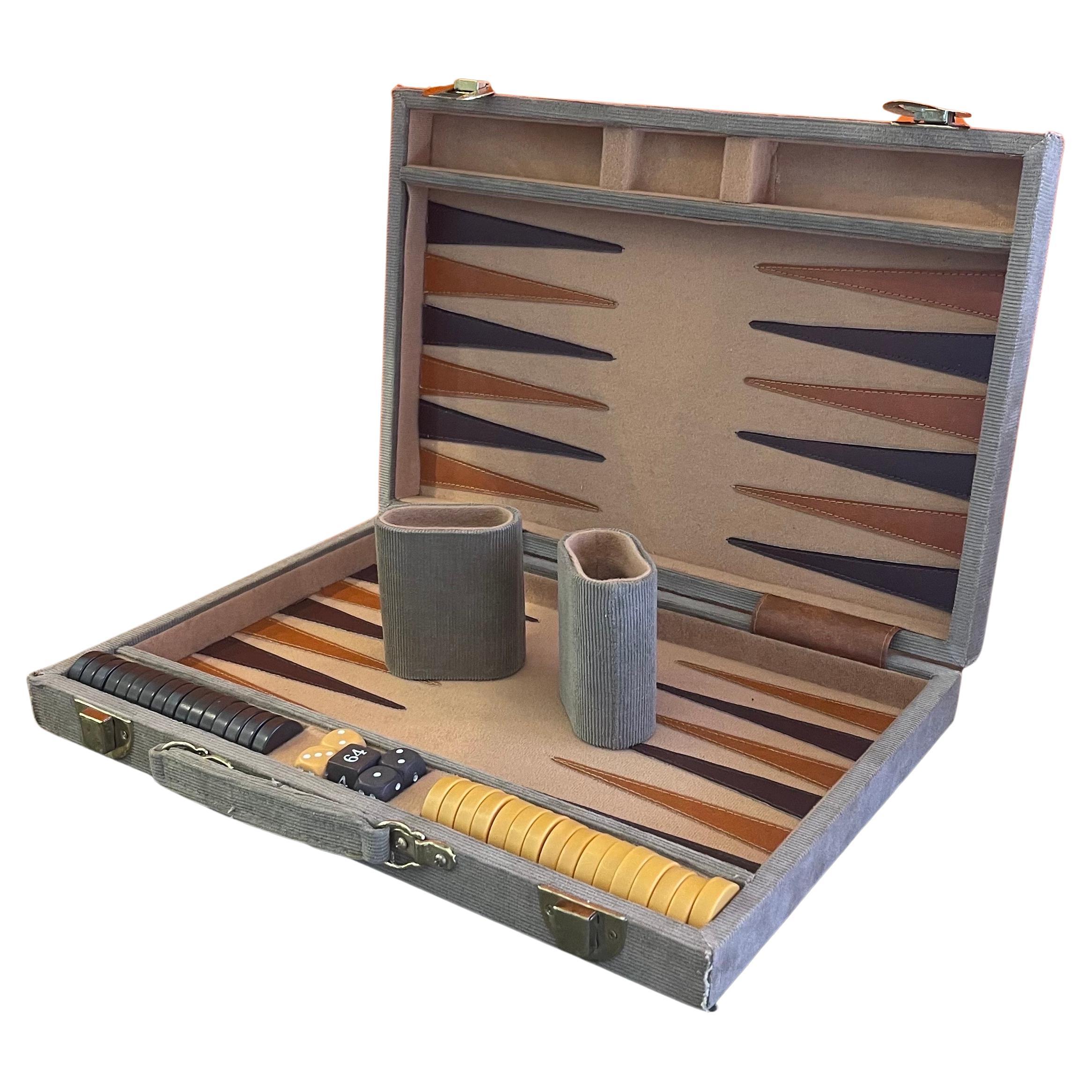 Vintage corduroy and bakelite backgammon set, circa 1970s. Set is complete with a foldable case / board with tan corduroy fabric, 32 (two extras) bakelite checkers (brown and tan in color, 1.125