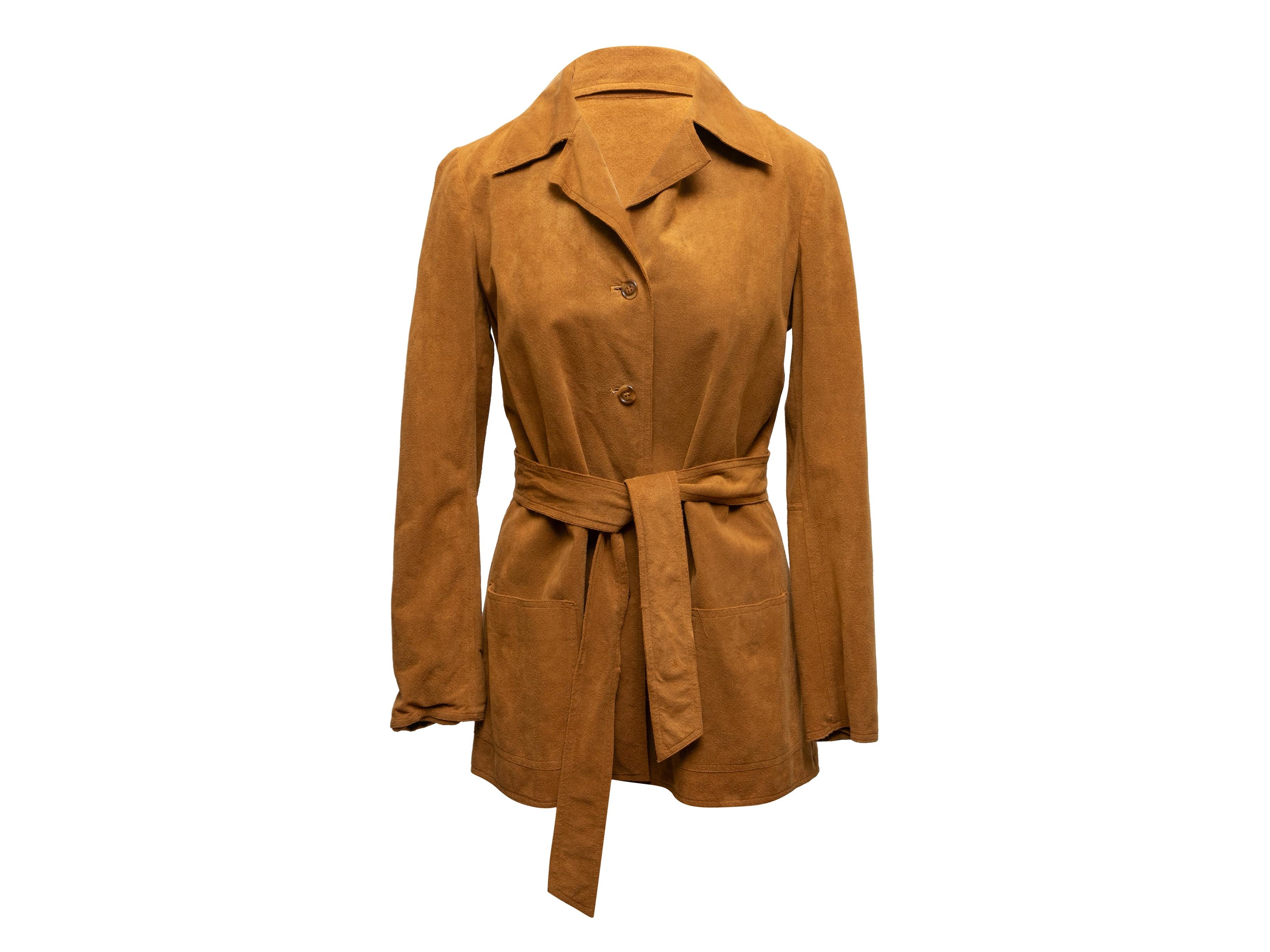 Vintage tan Ultrasuede jacket by Halston. Circa 1970s. Pointed collar. Sash tie at waist. Dual hip pockets. Button closures at center front. 34