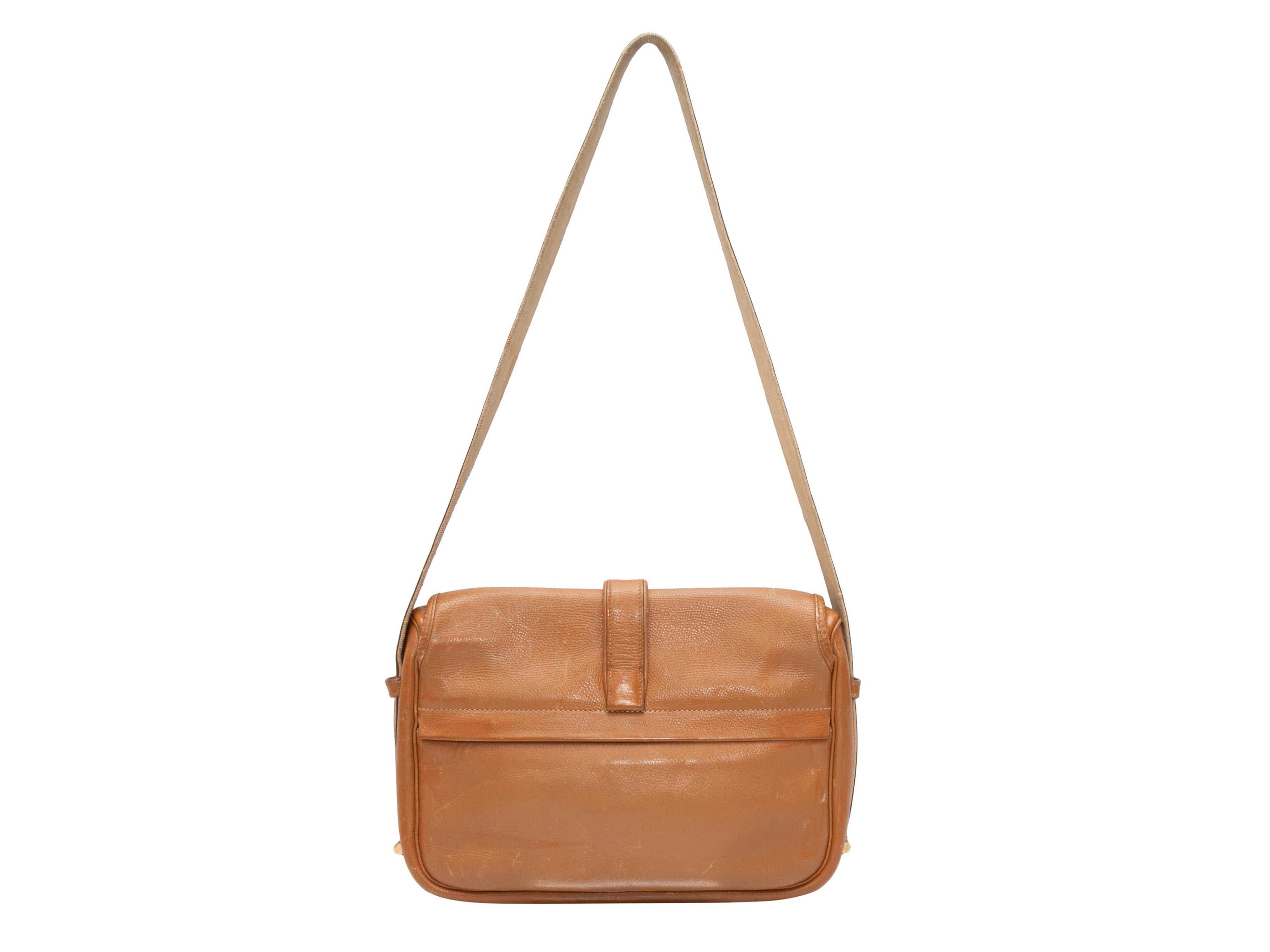 Vintage Tan Hermes 1980s Nouema Bag. The Nouema Bag features a natural buffalo leather body, gold-tone hardware, a single flat shoulder strap, and a front flap closure. 12