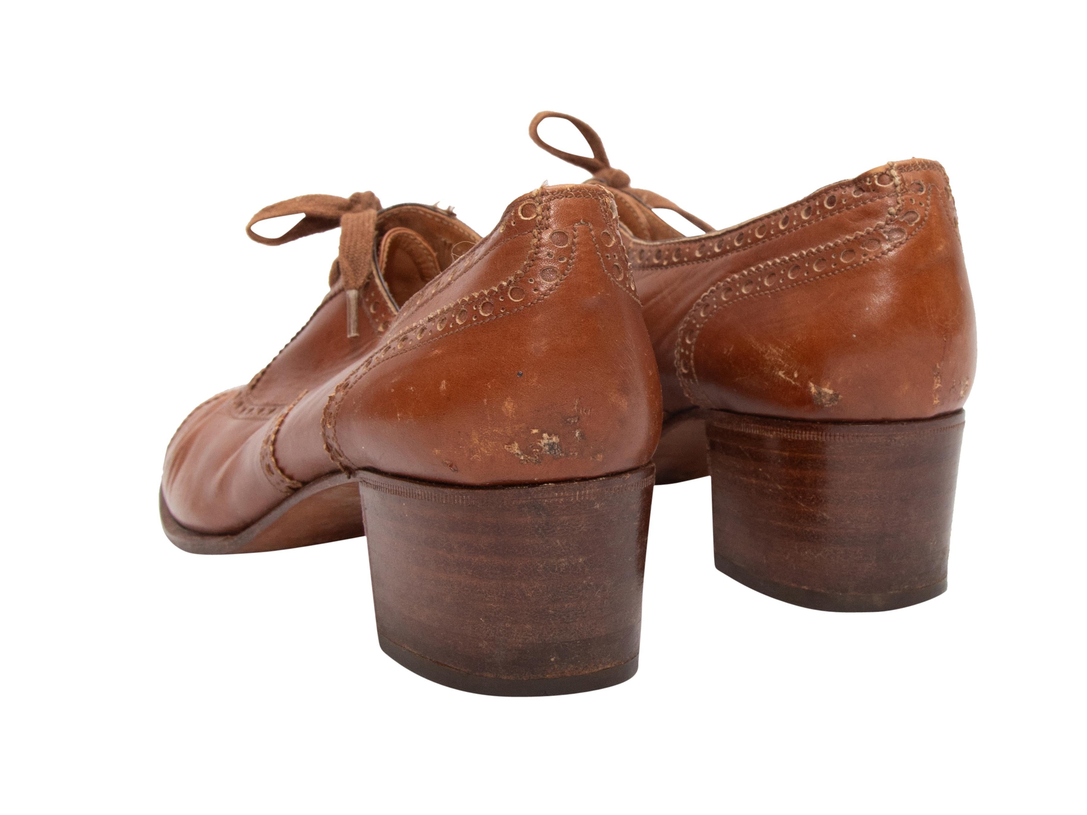 Vintage tan leather heeled oxfords by Hermes. Stacked heels. Lace-up tie closures at tops. 2