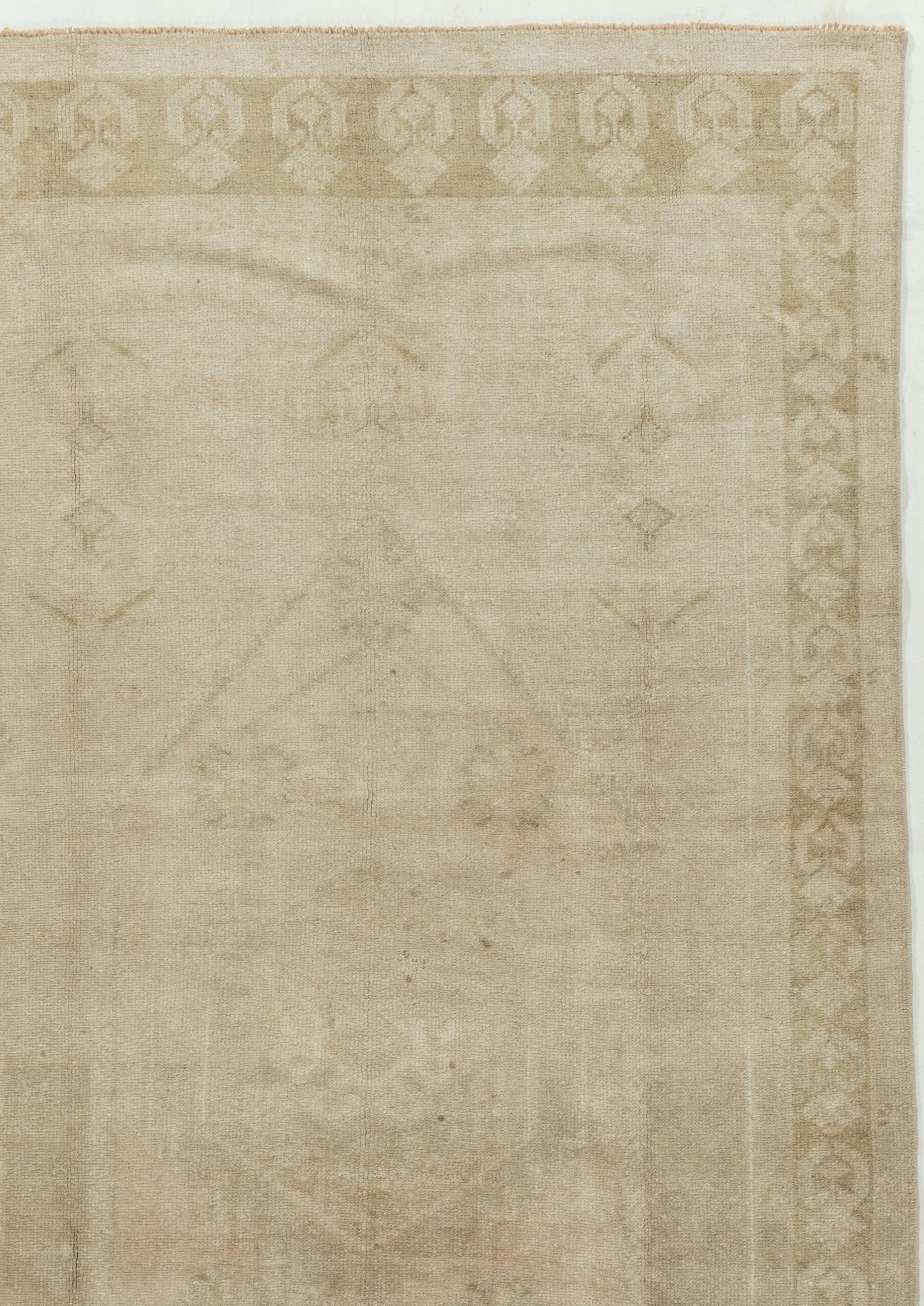 3'11 X 7'4. Character, tradition, pattern and palette converge in this gorgeous vintage hand knotted Turkish rug, woven in the small west-central Anatolian region. The rug-weaving is in west-central Anatolia, approximately 100 miles south of