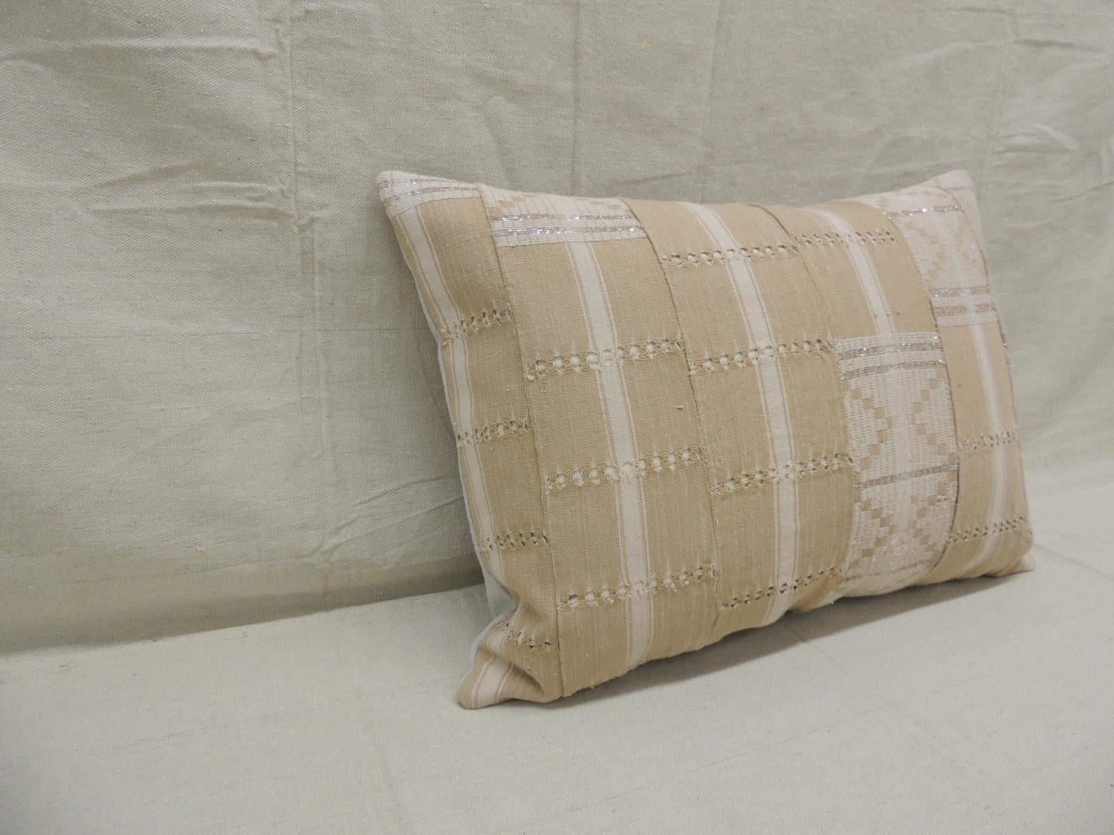 Vintage tan and brown woven ewe stripweaves and white embroidery African long bolster
decorative pillow with silver embroidered metallic threads.
With textured grey cotton backing.
Decorative pillow handcrafted and designed in the USA.
Closure