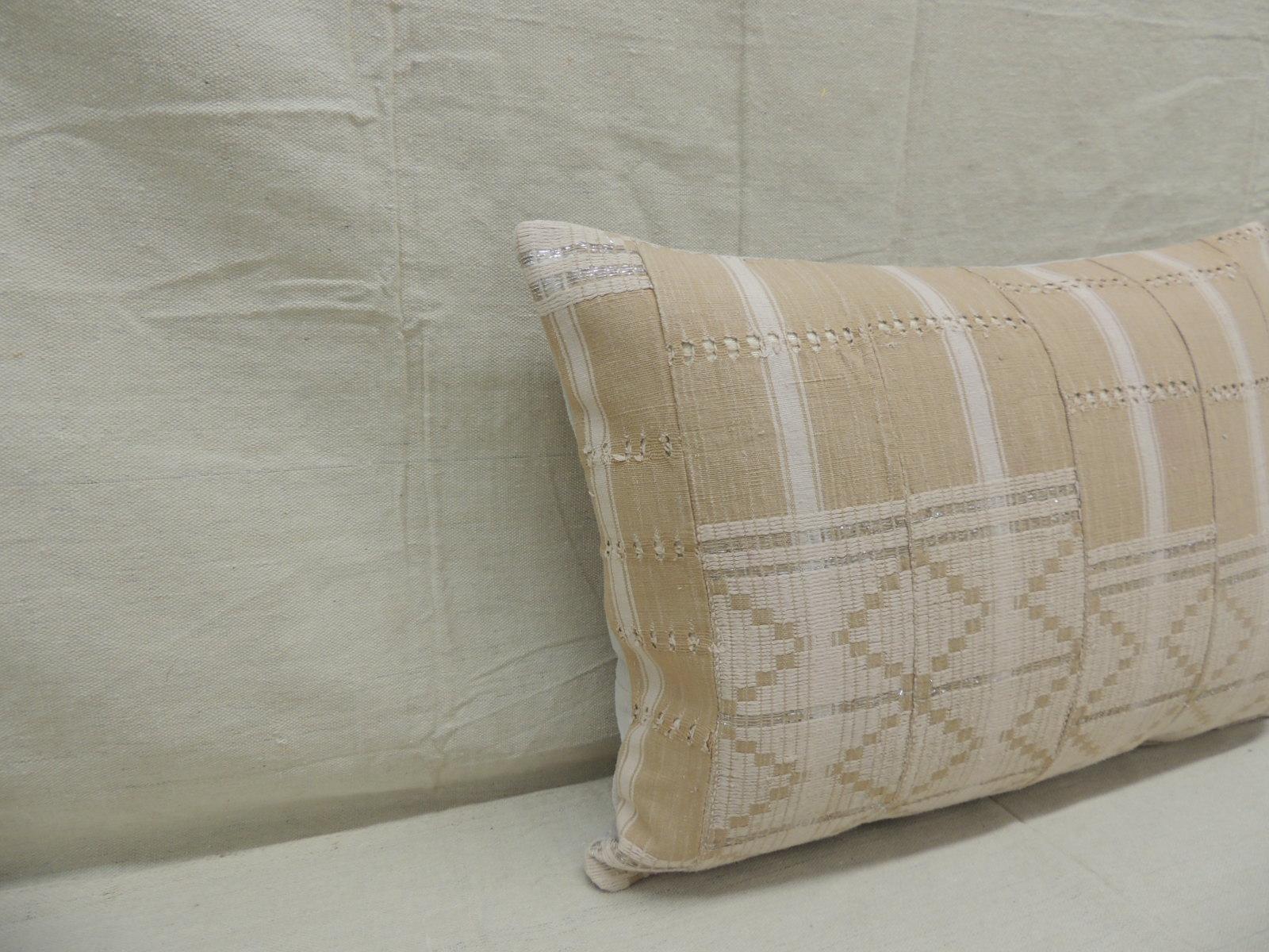 Vintage tan and brown woven ewe stripweaves and white embroidery African long bolster
 decorative pillow with silver embroidered metallic threads.
With textured grey cotton backing.
Decorative pillow handcrafted and designed in the USA.
Closure