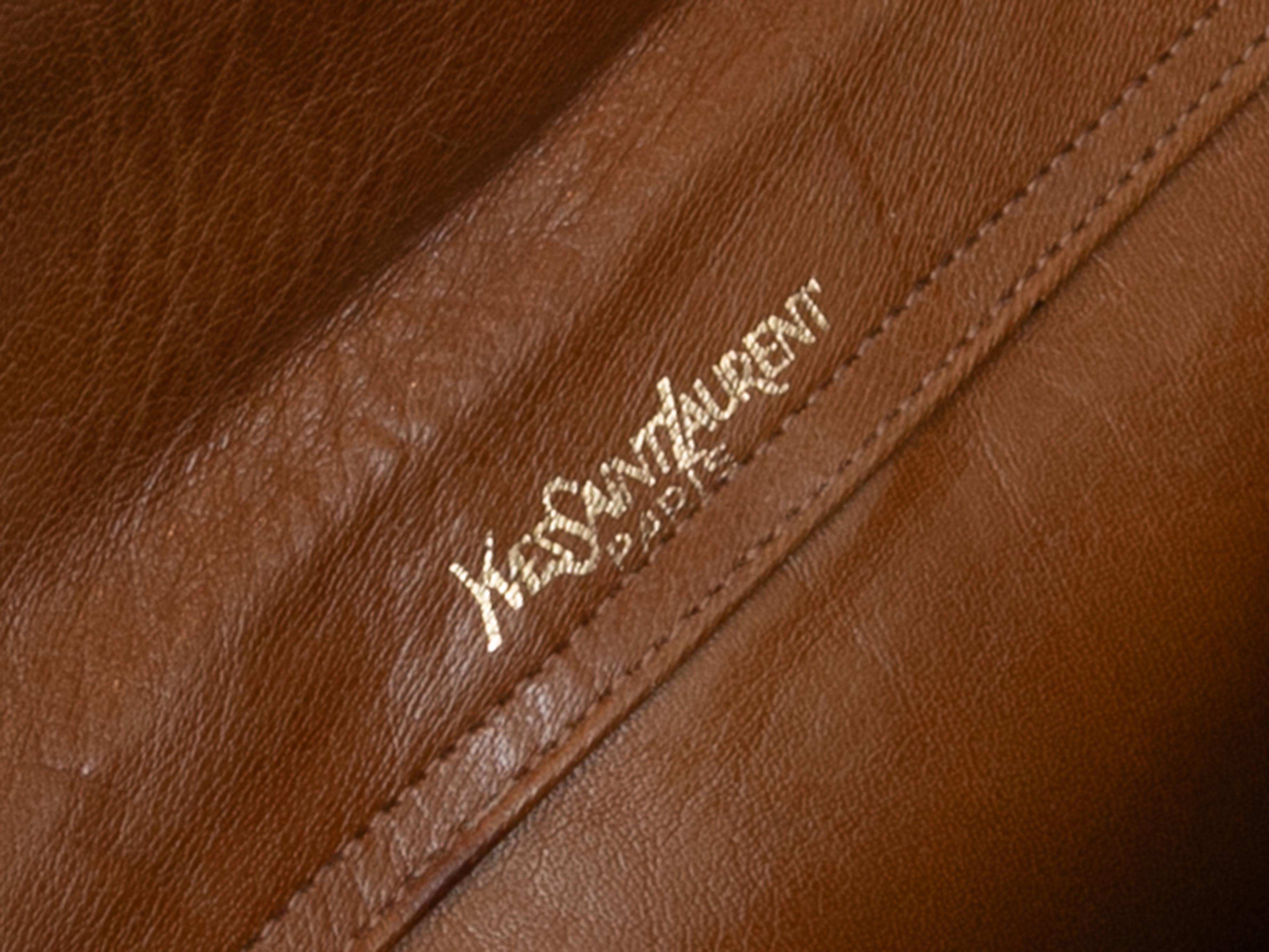 Vintage Tan Yves Saint Laurent Portfolio Bag. This bag features a leather body, multiple interior pockets, and dual wooden ring top handles. 11