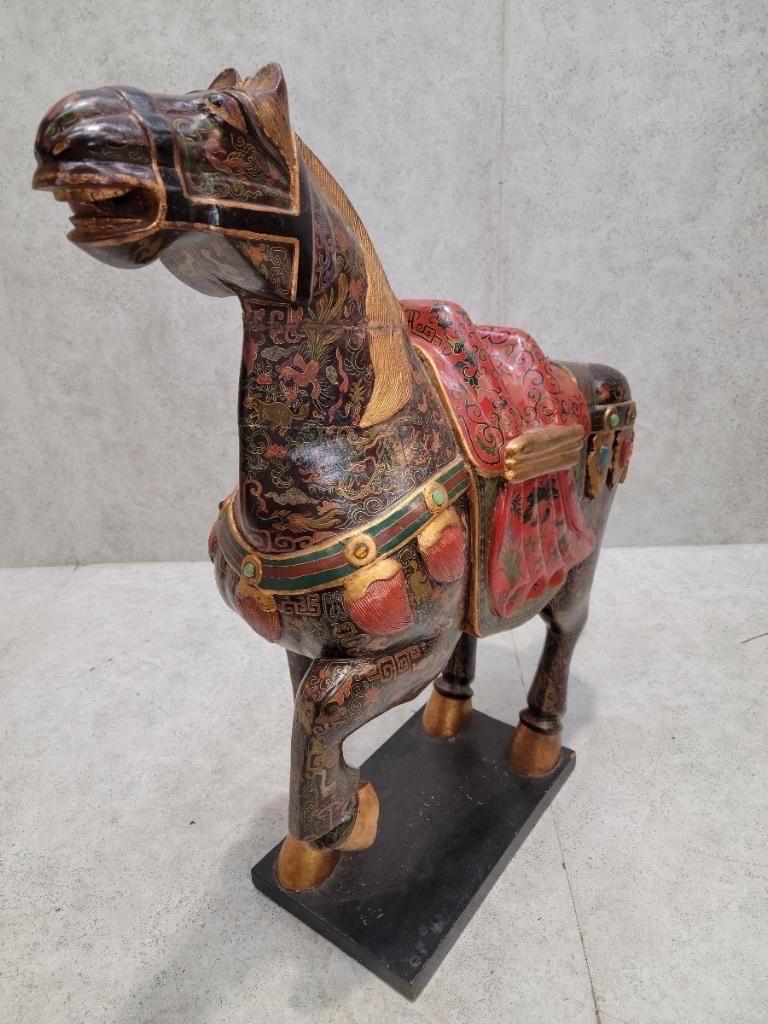 Vintage Tang Dynasty Style Carved and Hand Painted War Horse Floor Statues Sculptures - Set of 2

Stunning pair of large intricately carved wooden horses in a prancing pose from the Tang Dynasty. A superb piece of Chinese folk art, featuring a hand