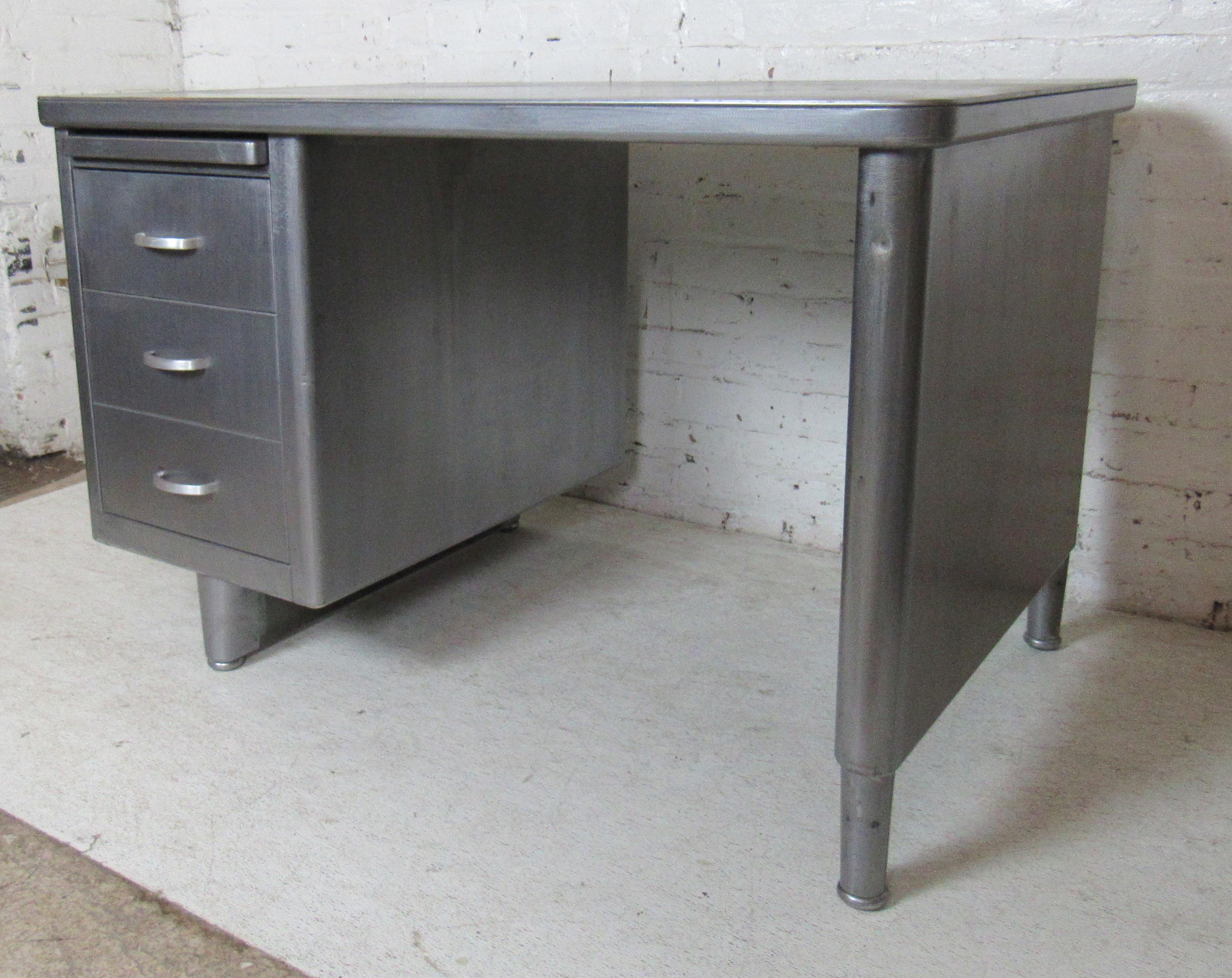 Midcentury metal tanker style desk with two drawers and pull out writing shelf.
(Please confirm item location - NY or NJ - with dealer).
 
